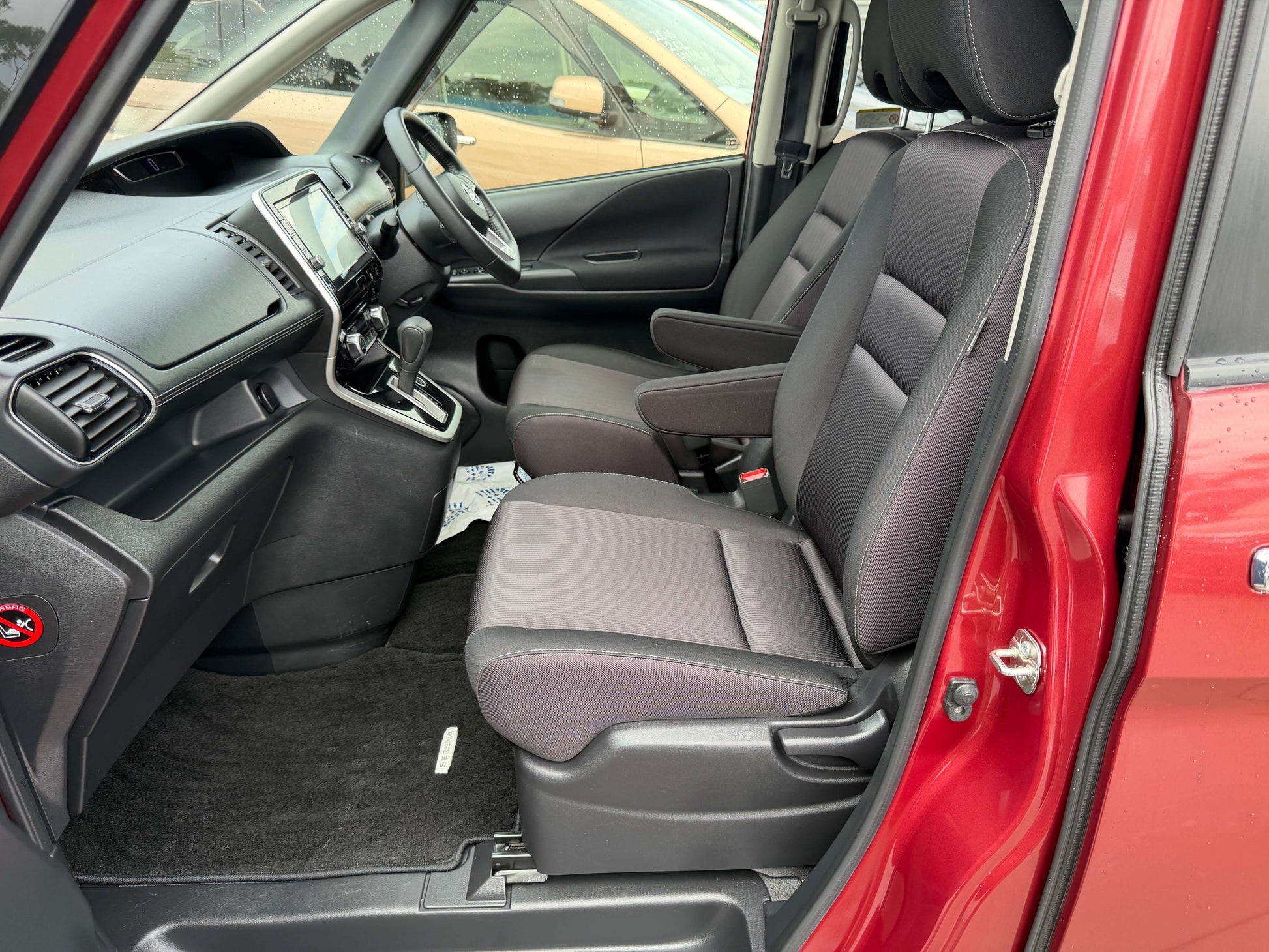 Interior view of 2018 Nissan Serena 2.0L S-Hybrid Highway Star with spacious seating and modern dashboard.