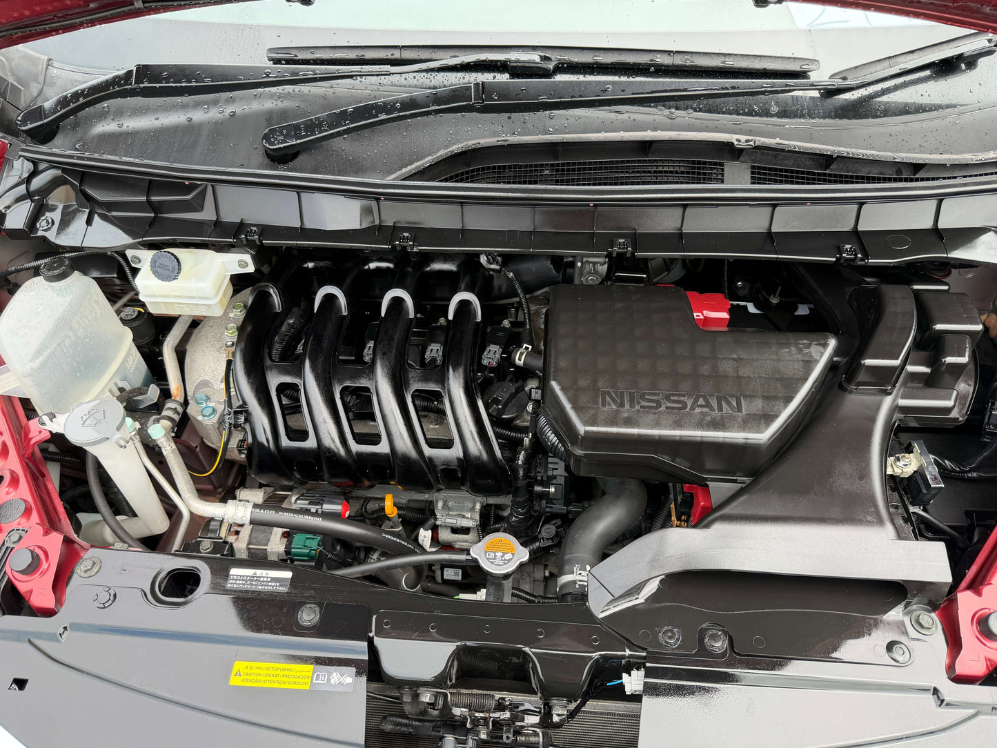 Engine compartment of a 2018 Nissan Serena 2.0L S-Hybrid Highway Star Edition showcasing components.