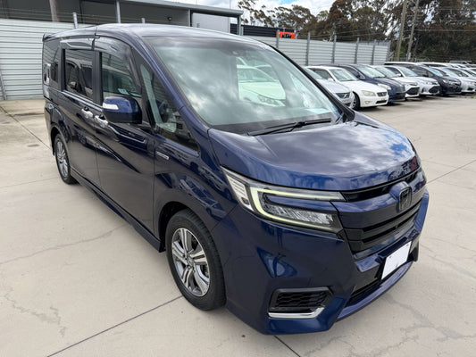 2018 Honda Honda Stepwgn 2.0 Spada Hybrid G EX Honda Sensing in blue, showcasing its sleek design and family-friendly features.