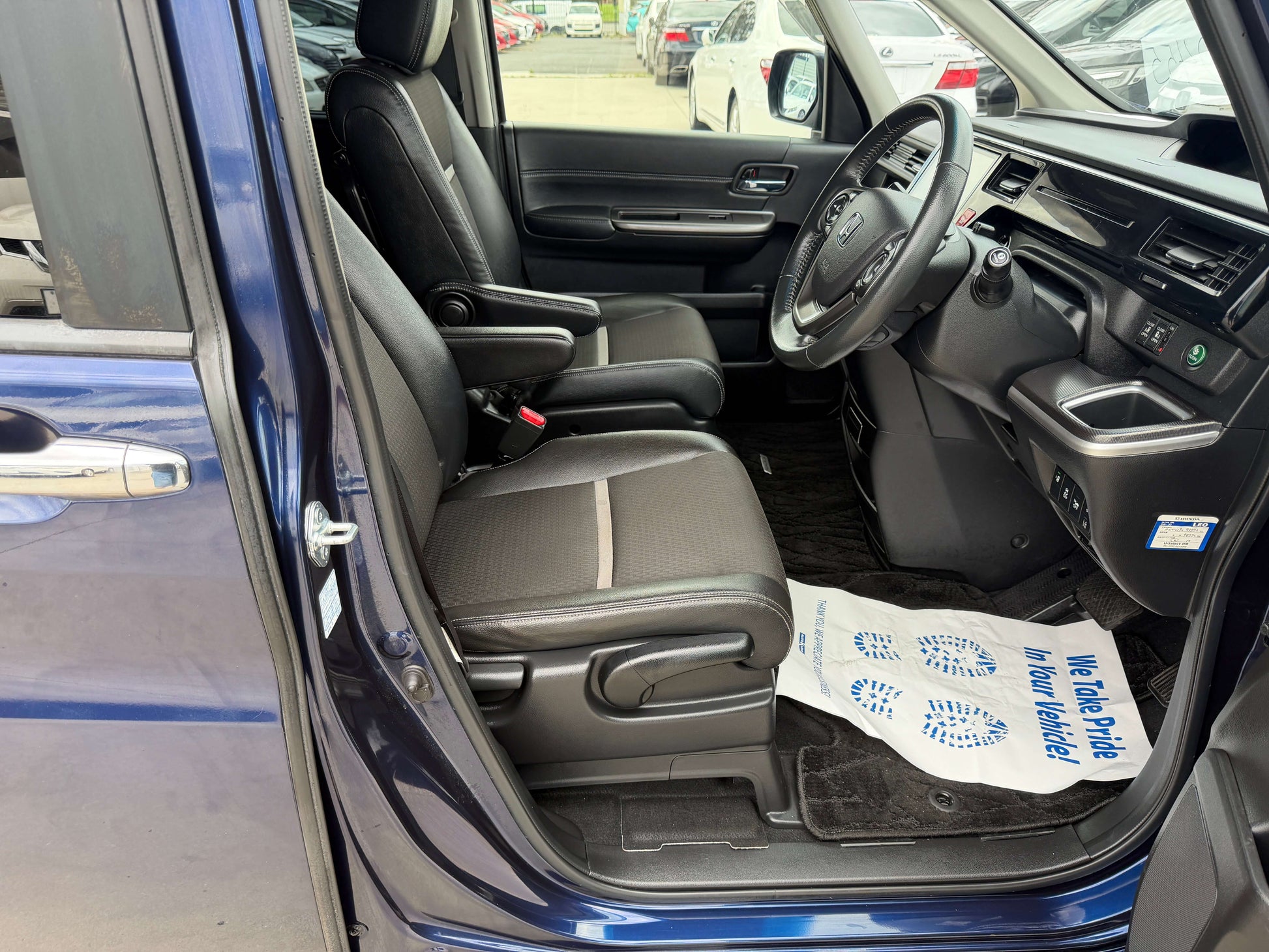 Interior view of a 2018 Honda Honda Stepwgn 2.0 Spada Hybrid with comfortable seating and modern dashboard features.