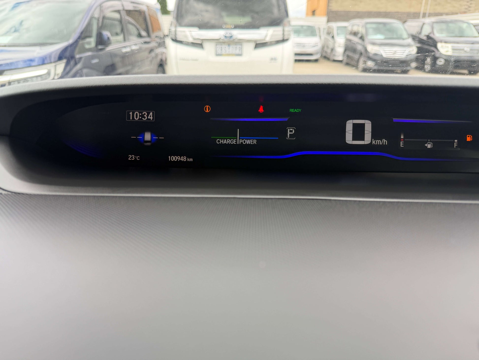 Dashboard display of a 2018 Honda Honda Stepwgn 2.0 Spada Hybrid with charge power indicator and speedometer.