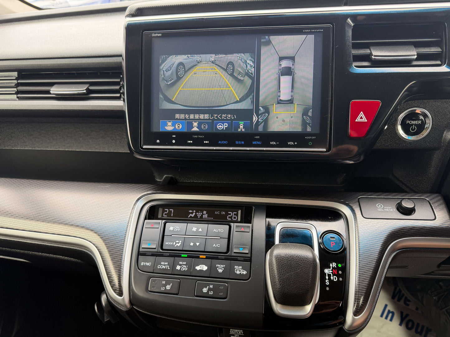 Interior view of the 2018 Honda Honda Stepwgn 2.0 Spada Hybrid with touchscreen display and parking assist camera.