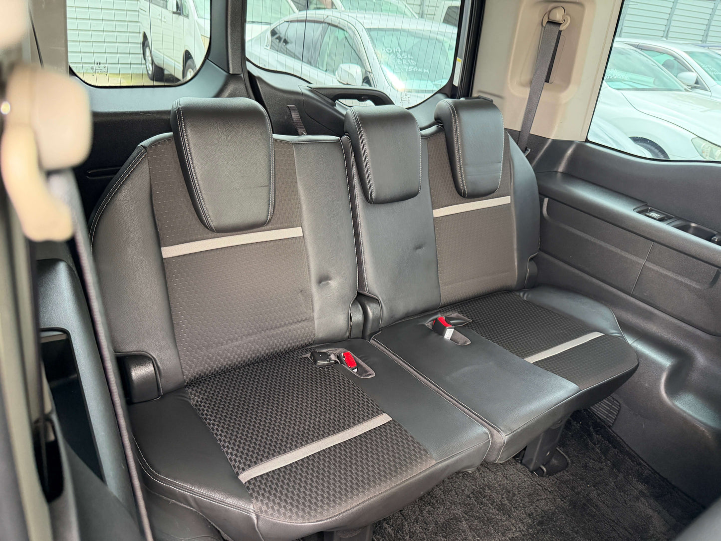 Interior seating of the 2018 Honda Honda Stepwgn 2.0 Spada Hybrid G EX Honda Sensing showing black upholstery and seat belts.