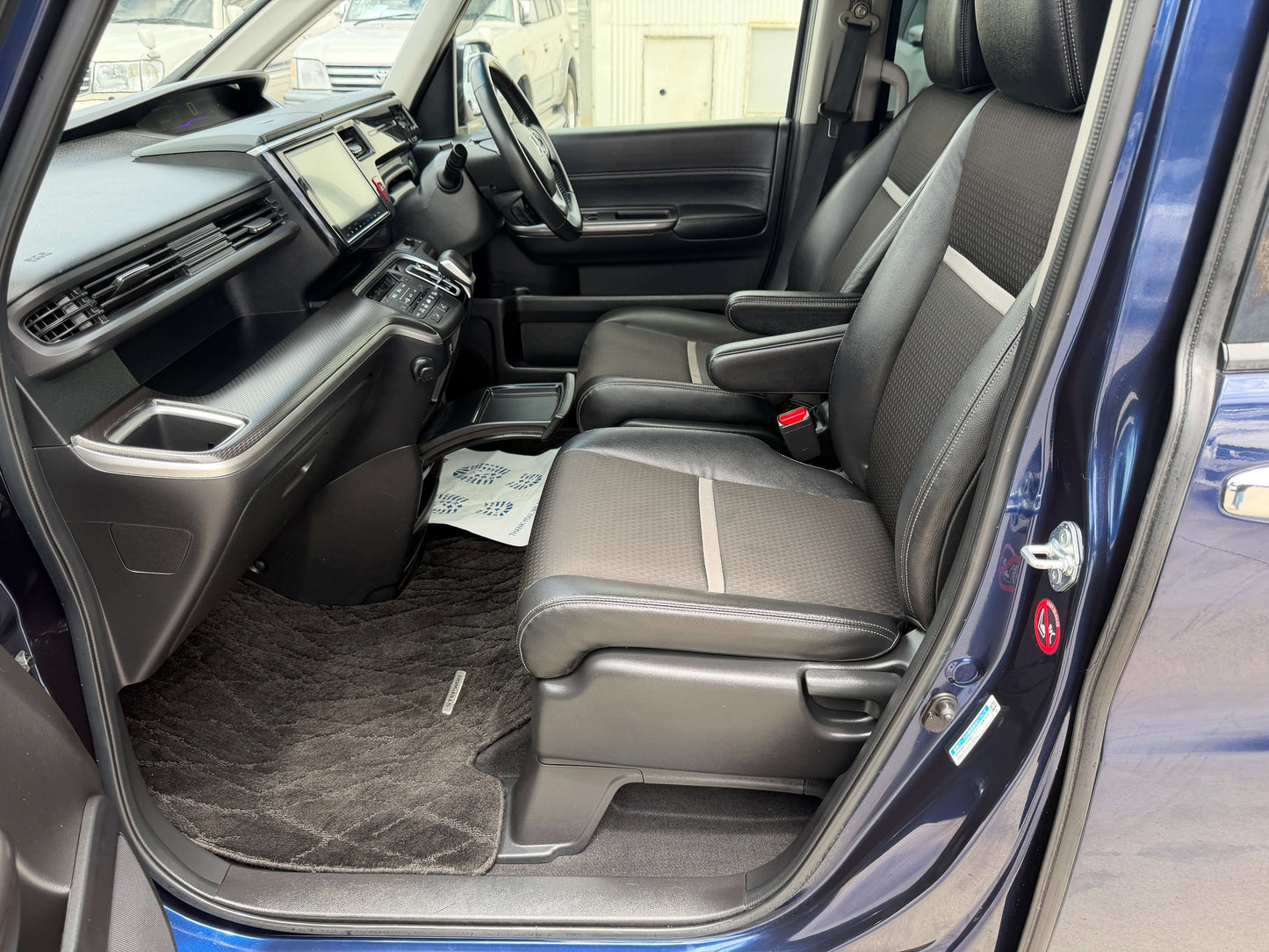 Interior view of 2018 Honda Honda Stepwgn 2.0 Spada Hybrid G EX Honda Sensing showcasing spacious seating and modern design.