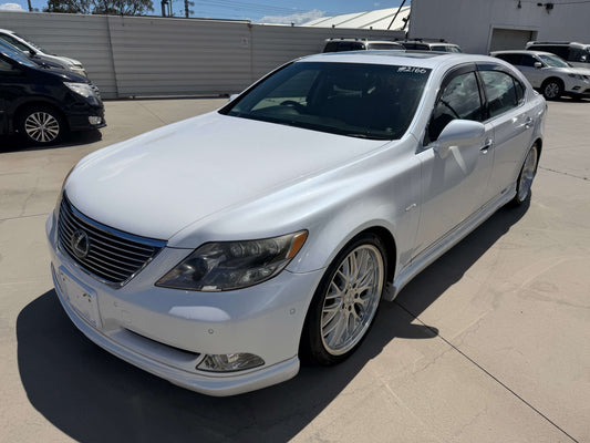 2007 Lexus LS600hL AWD V8 5.0L Hybrid Luxury Sedan in white with custom wheels.