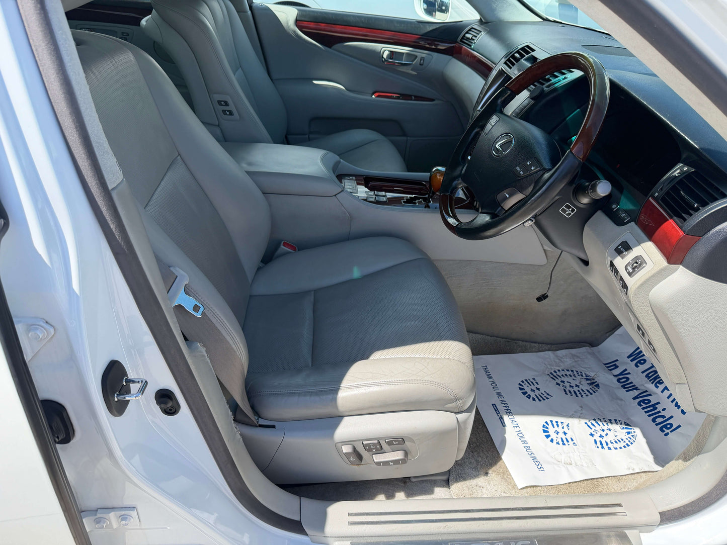 Interior view of the 2007 Lexus LS600hL AWD V8 5.0L Hybrid luxury sedan showing leather seats and dashboard.