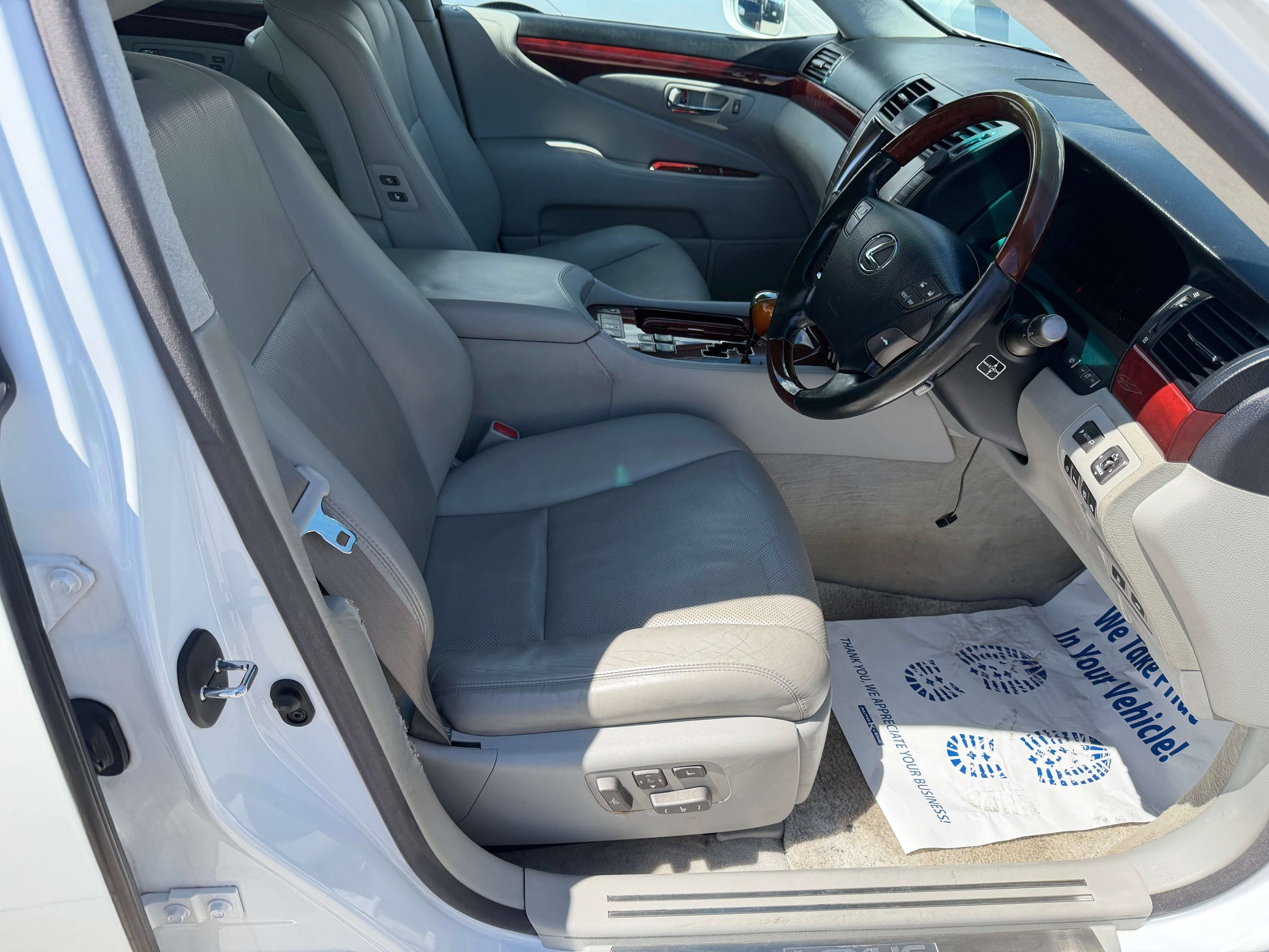 Interior view of the 2007 Lexus LS600hL AWD V8 5.0L Hybrid luxury sedan showing leather seats and dashboard.