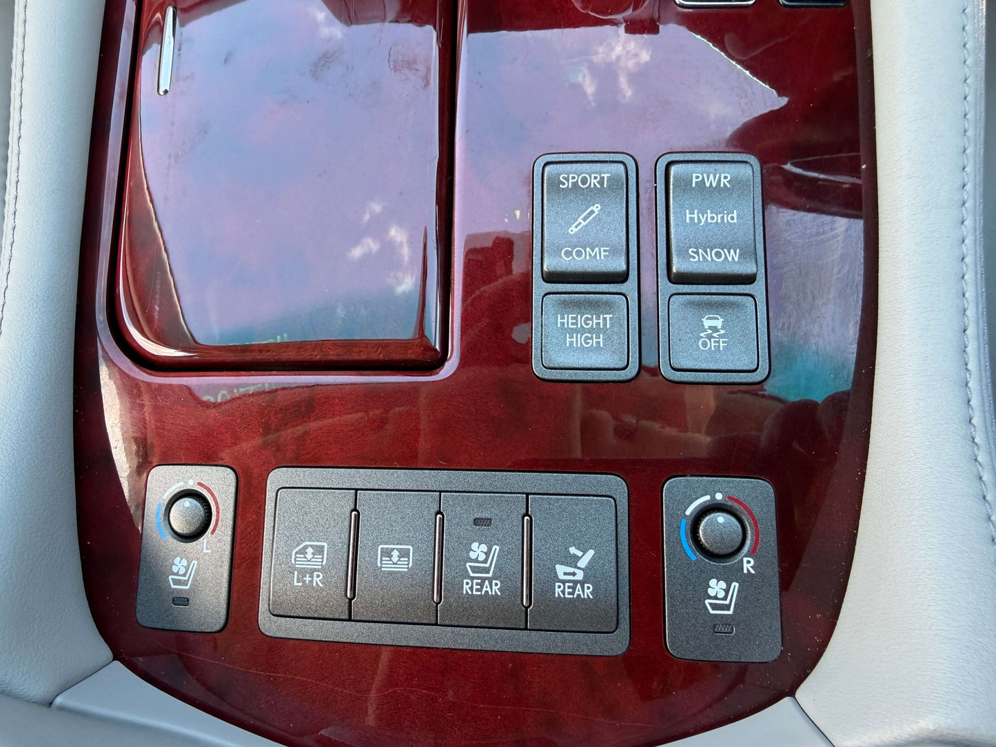 Interior controls and buttons of a 2007 Lexus LS600hL AWD V8 5.0L Hybrid for sport, power, and seating adjustments.