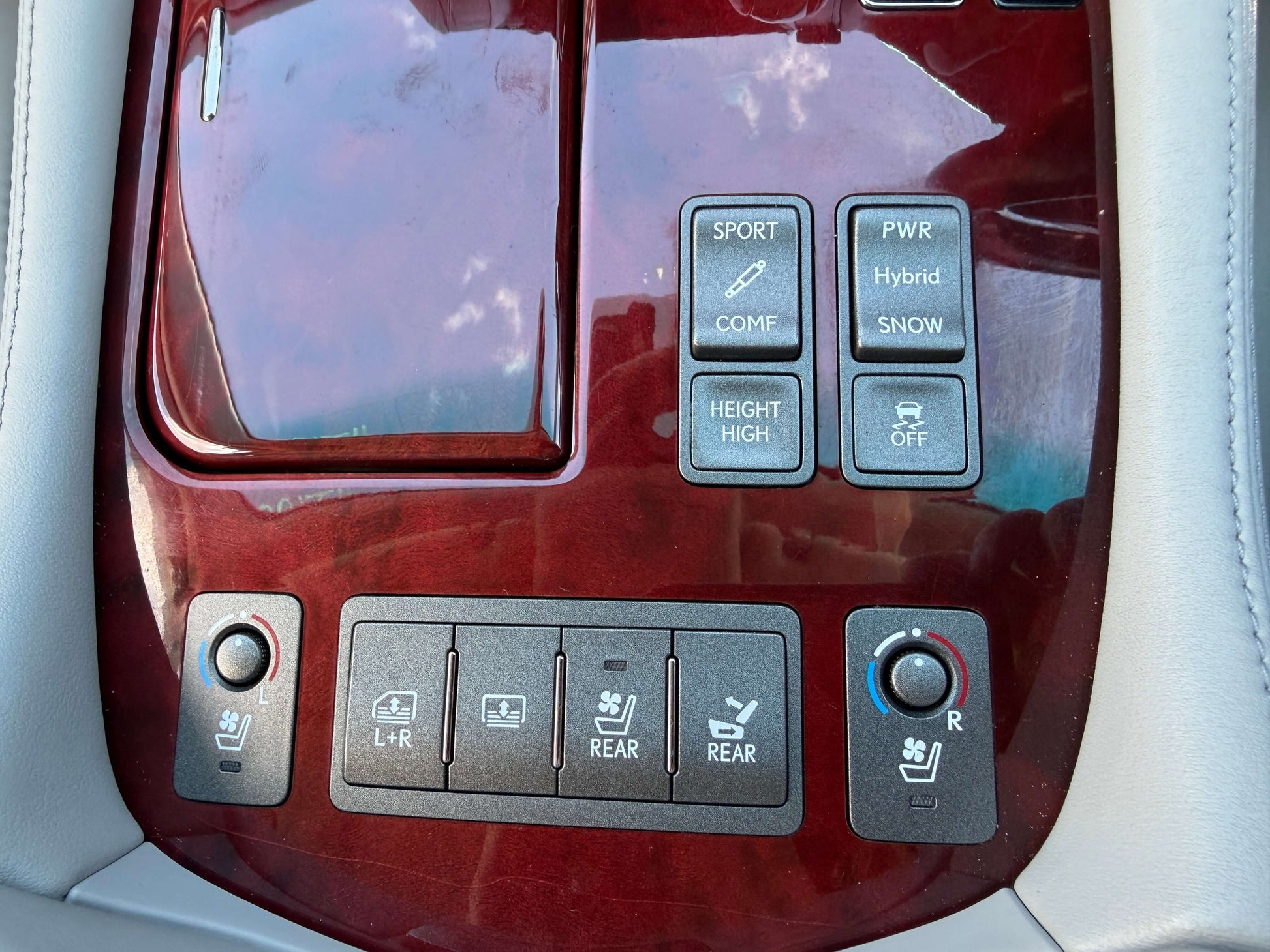 Interior controls and buttons of a 2007 Lexus LS600hL AWD V8 5.0L Hybrid for sport, power, and seating adjustments.