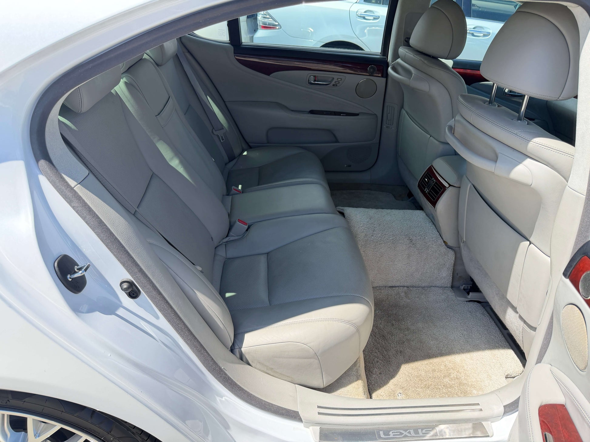 2007 Lexus LS600hL AWD V8 5.0L Hybrid luxury sedan interior back seat with spacious gray leather seating.