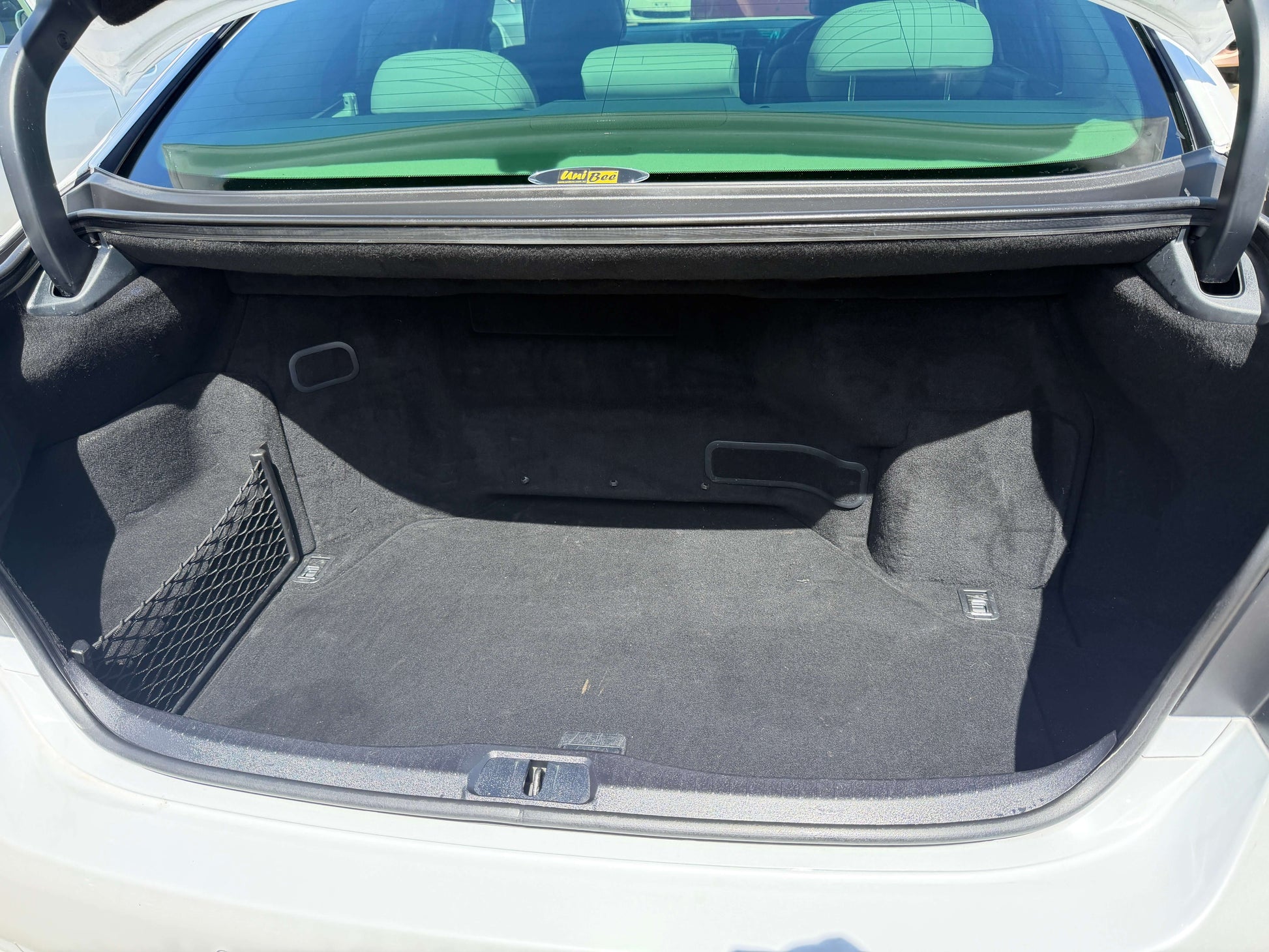 Trunk space of a 2007 Lexus LS600hL AWD V8 5.0L Hybrid Luxury Sedan, showcasing ample storage capacity.