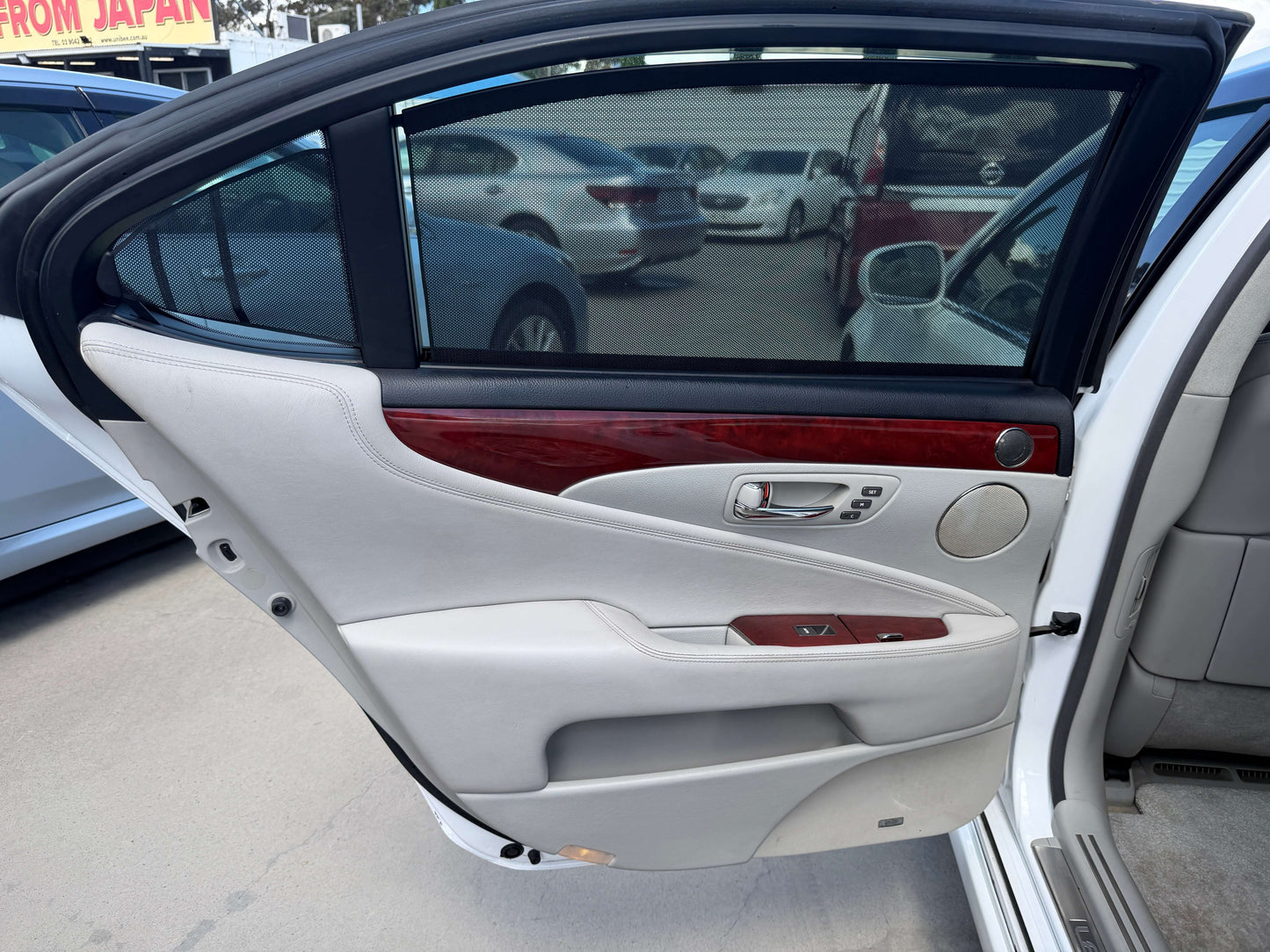 Interior view of the driver's side door of a 2007 Lexus LS600hL AWD V8 5.0L Hybrid Luxury Sedan.