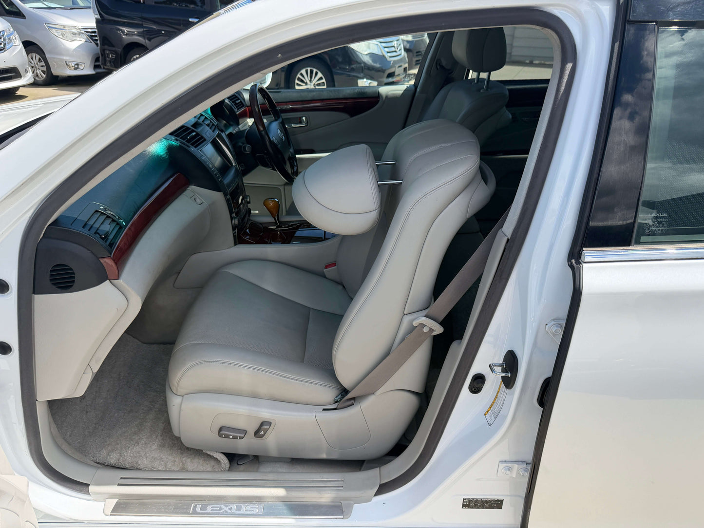 Interior view of a 2007 Lexus LS600hL AWD V8 5.0L Hybrid luxury sedan showcasing leather seats.