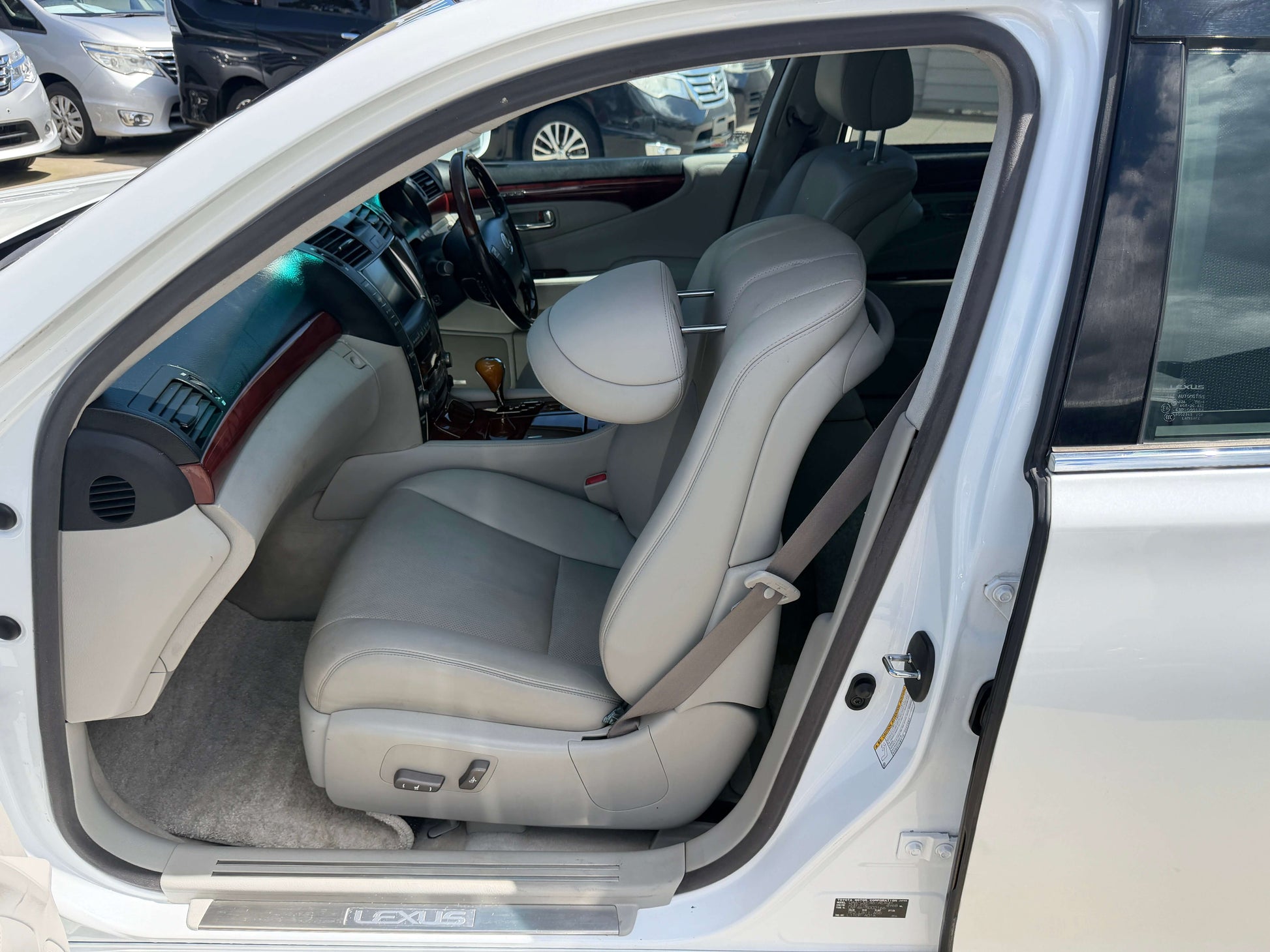 Interior view of a 2007 Lexus LS600hL AWD V8 5.0L Hybrid luxury sedan showcasing leather seats.