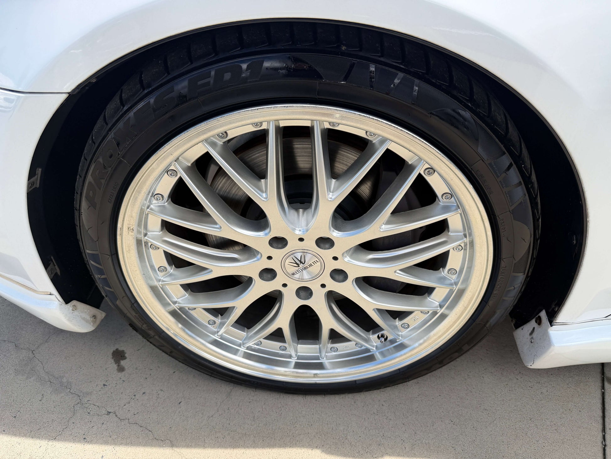 2007 Lexus LS600hL AWD V8 5.0L Hybrid luxury sedan wheel close-up showcasing stylish alloy rim and tire.