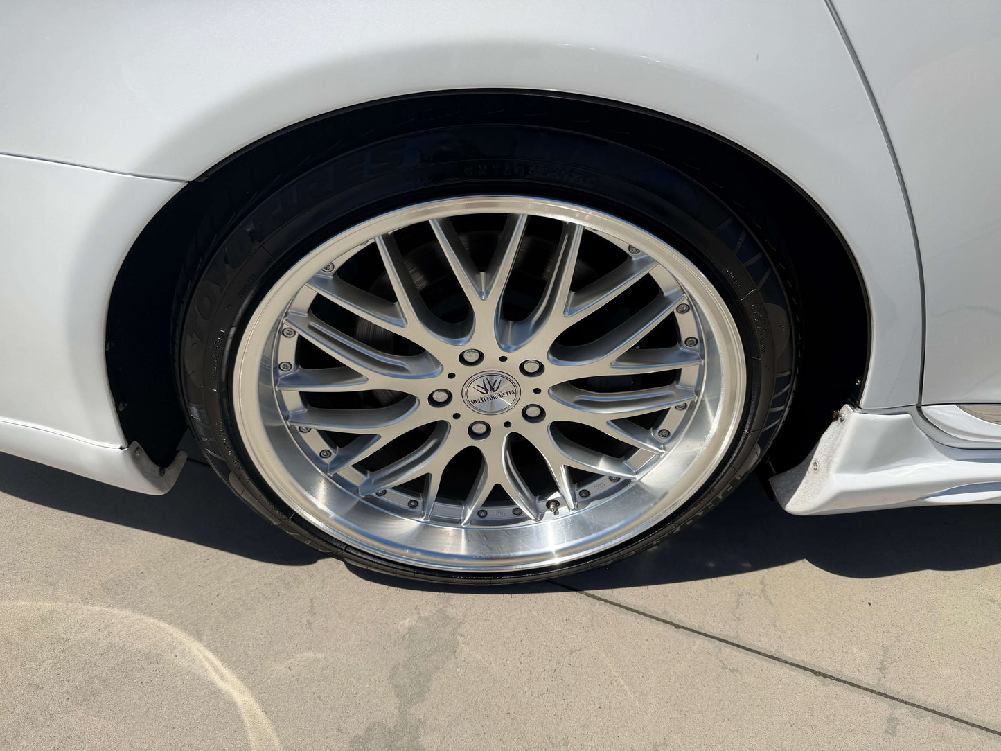 Close-up of the stylish rim of a 2007 Lexus LS600hL AWD V8 5.0L Hybrid luxury sedan.