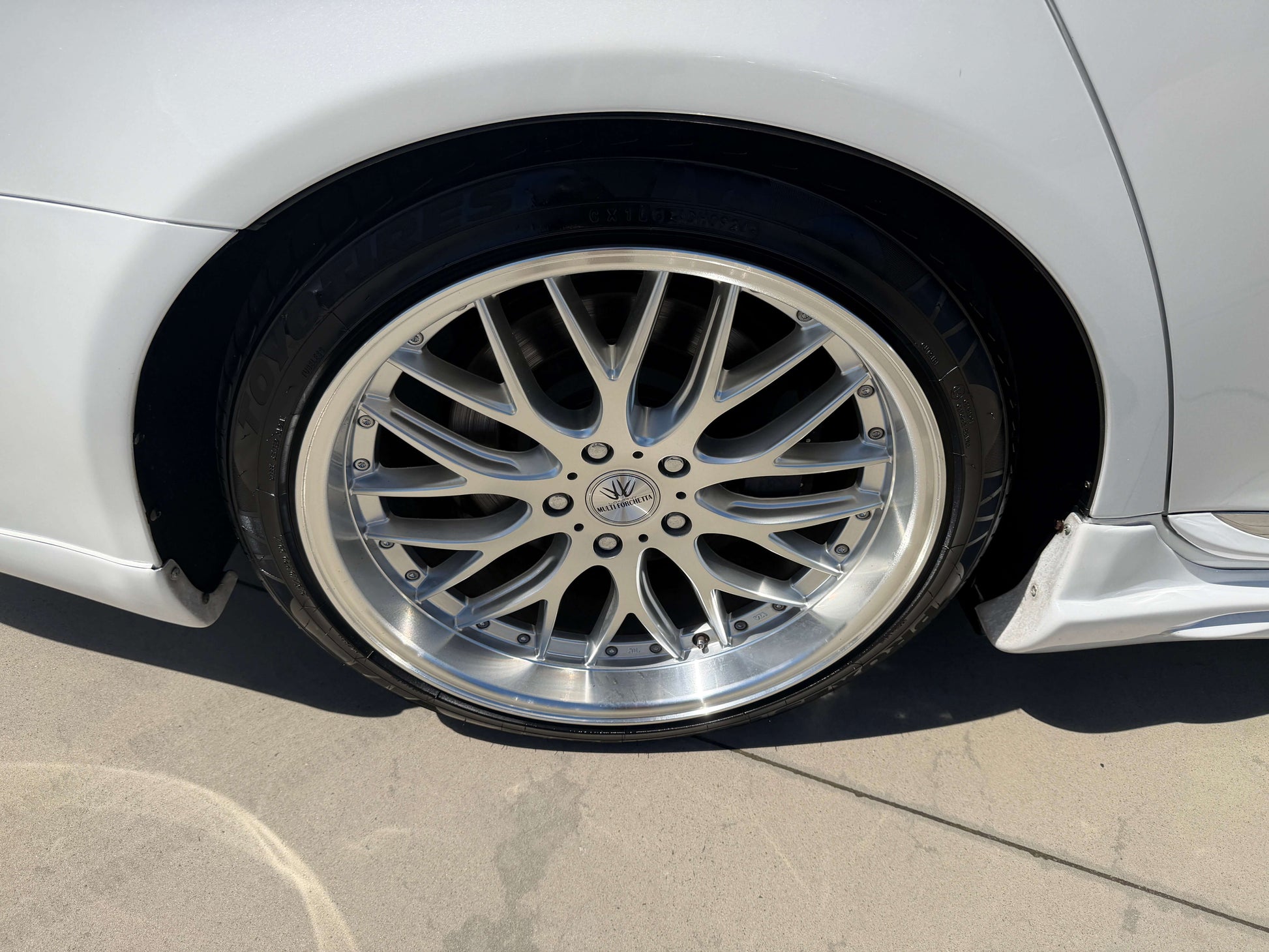 Close-up of the stylish rim of a 2007 Lexus LS600hL AWD V8 5.0L Hybrid luxury sedan.