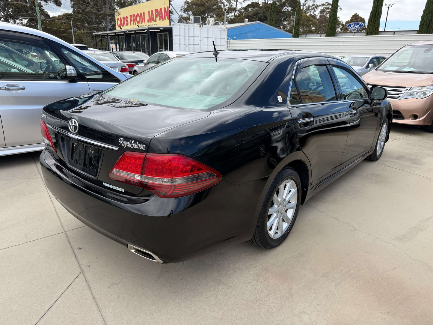 2008 Toyota Crown V6 3.0L Royal Saloon Edition luxury sedan black exterior rear view.