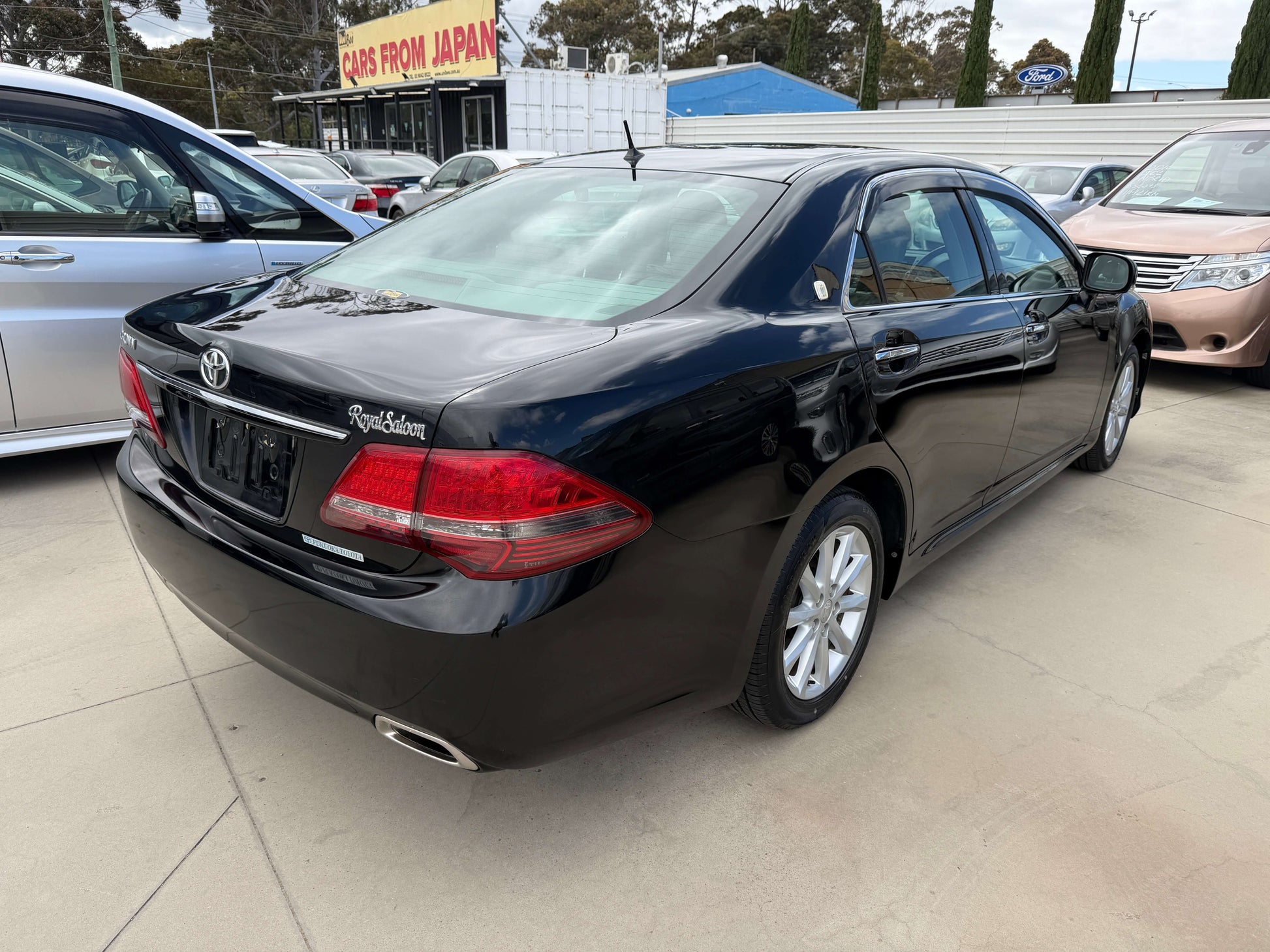 2008 Toyota Crown V6 3.0L Royal Saloon Edition luxury sedan black exterior rear view.