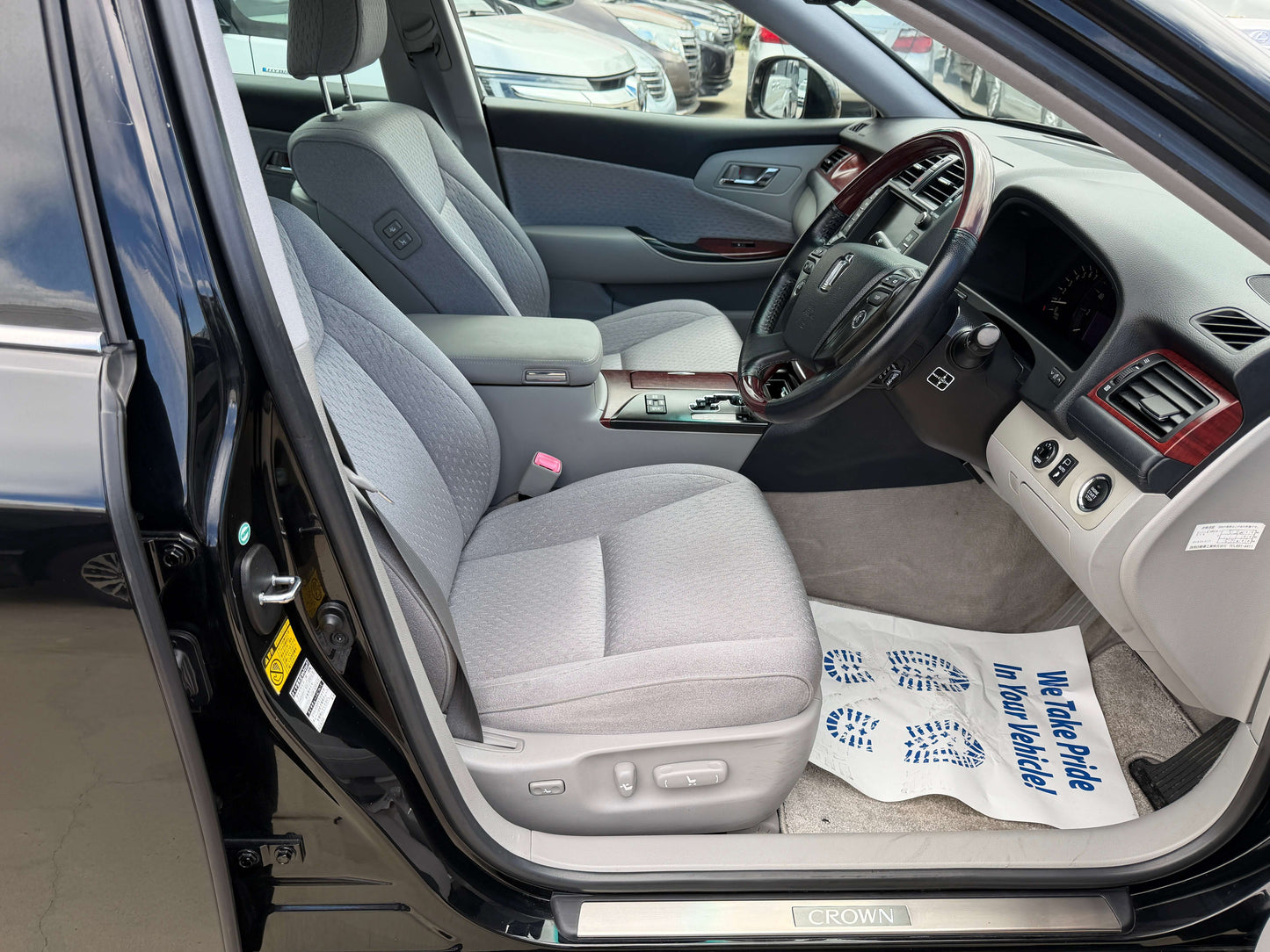 Interior view of 2008 Toyota Crown V6 3.0L Royal Saloon showing light-grey seating and dashboard features.