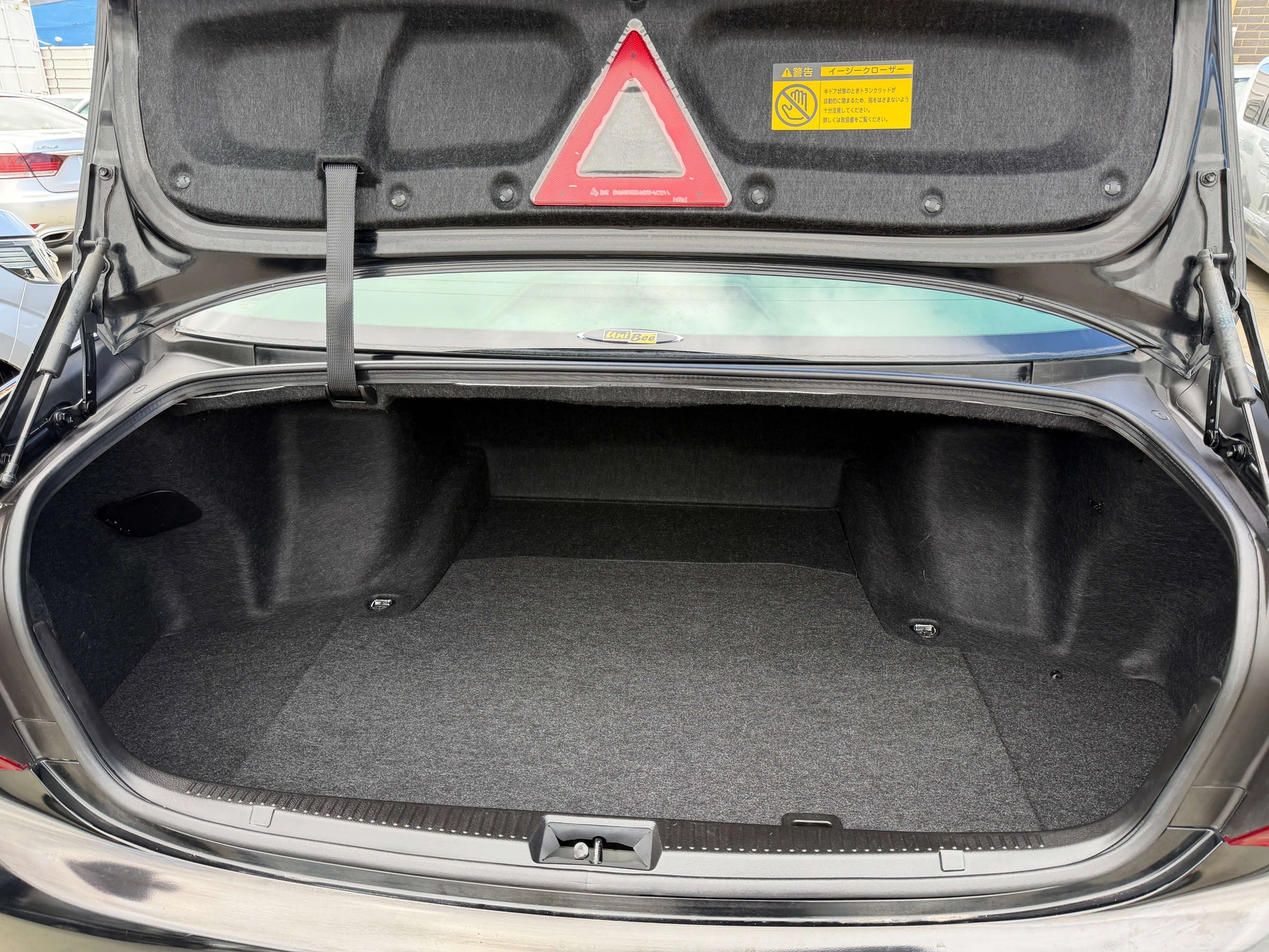 2008 Toyota Crown V6 3.0L trunk space showcasing ample storage in a luxury sedan.