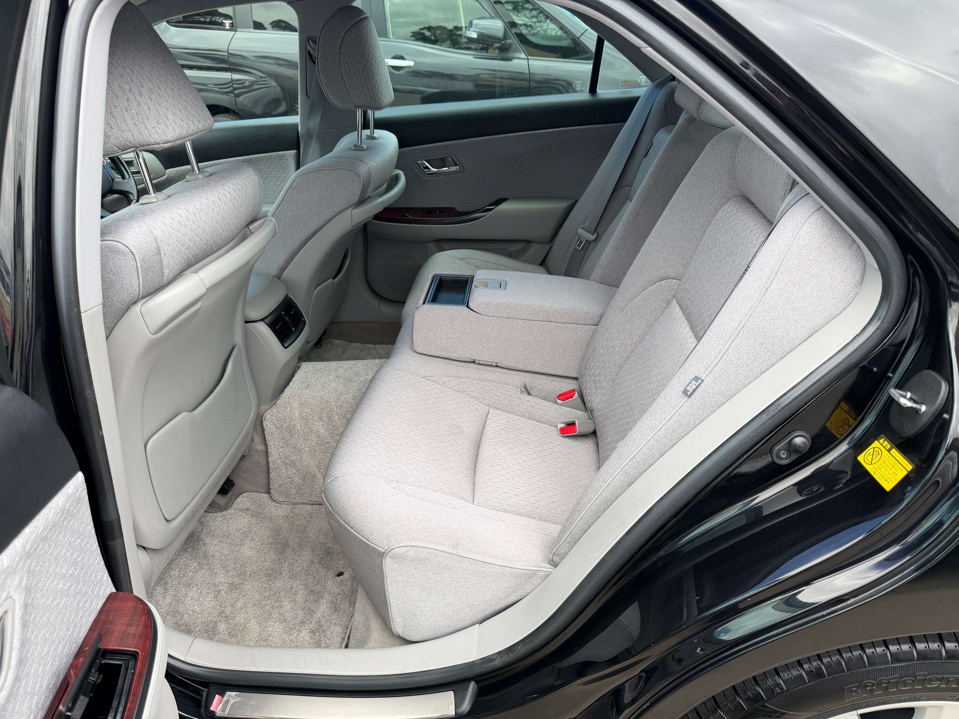 Interior view showcasing the spacious back seats of the 2008 Toyota Crown V6 3.0L Royal Saloon luxury sedan.