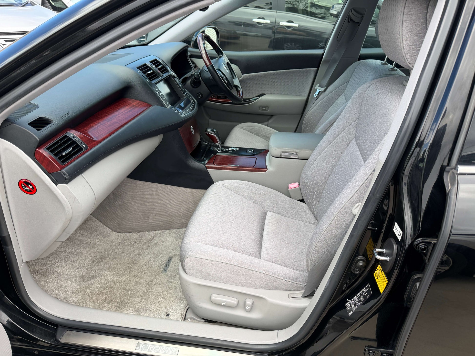 Interior view of 2008 Toyota Crown V6 3.0L Royal Saloon showing plush light-grey seats and dashboard.