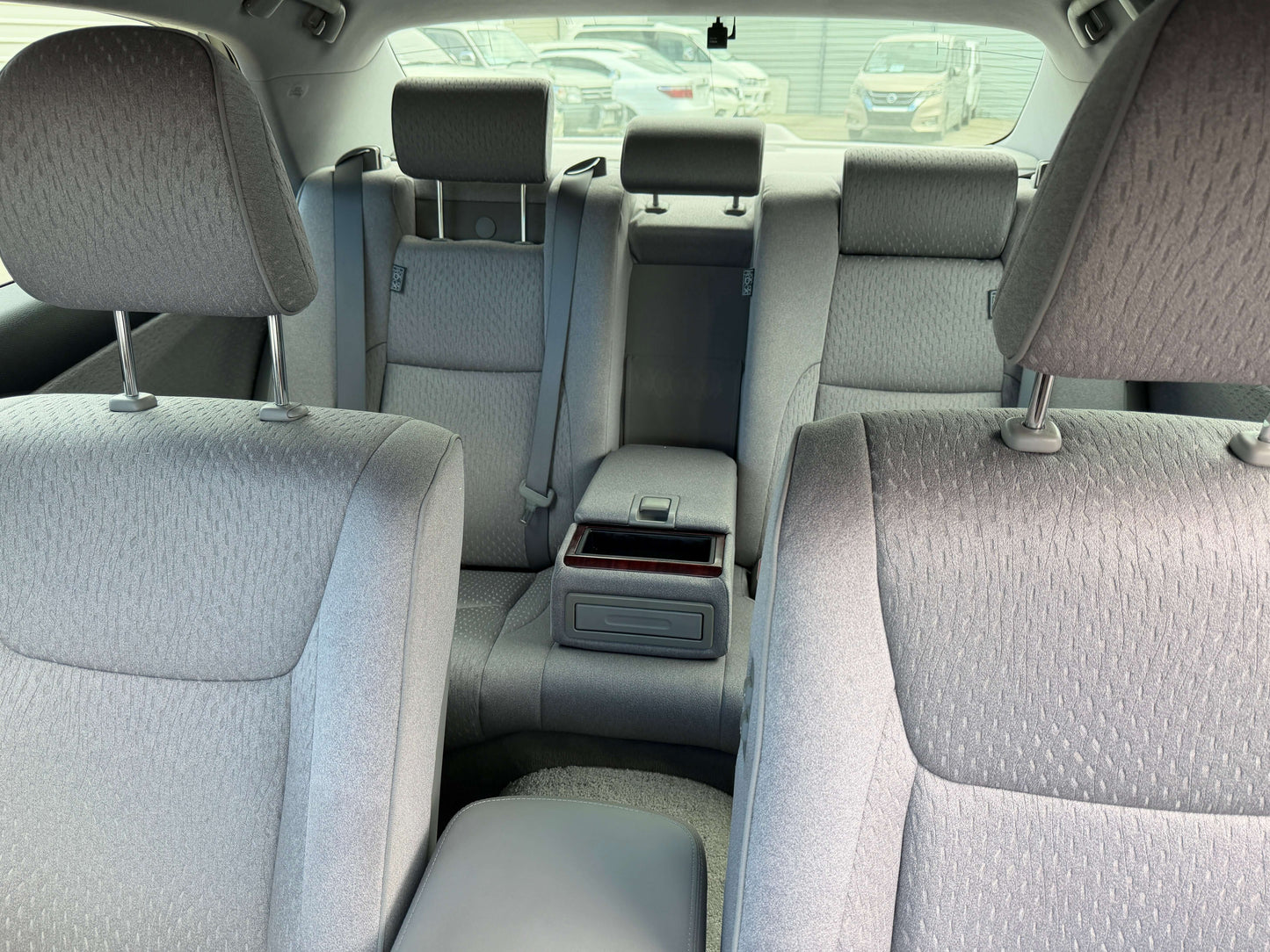 Interior view of the back seats in a 2008 Toyota Crown V6 3.0L Royal Saloon Edition Luxury Sedan.