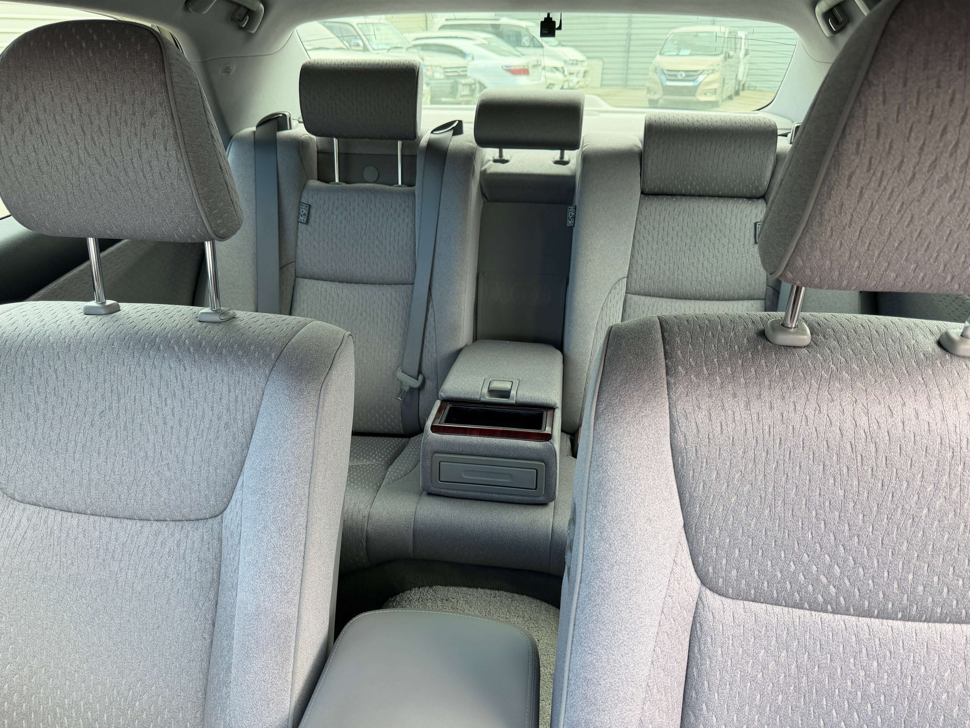 Interior view of the back seats in a 2008 Toyota Crown V6 3.0L Royal Saloon Edition Luxury Sedan.