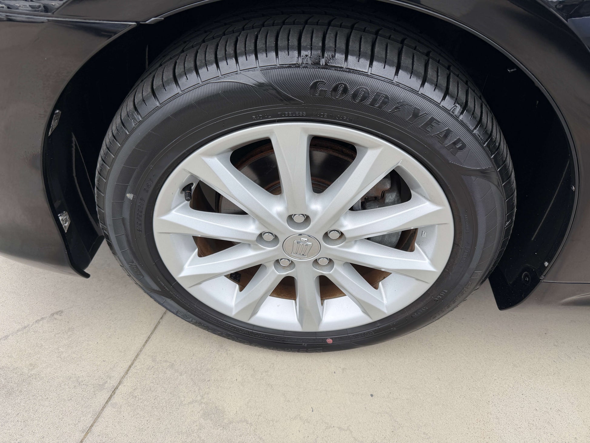 2008 Toyota Crown V6 3.0L luxury sedan wheel with Goodyear tire showing silver alloy rim.