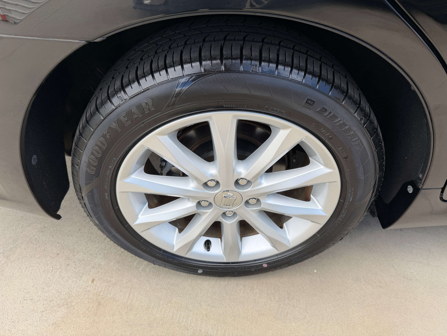 Close-up of a wheel and tire of a 2008 Toyota Crown V6 3.0L Royal Saloon Edition Luxury Sedan.