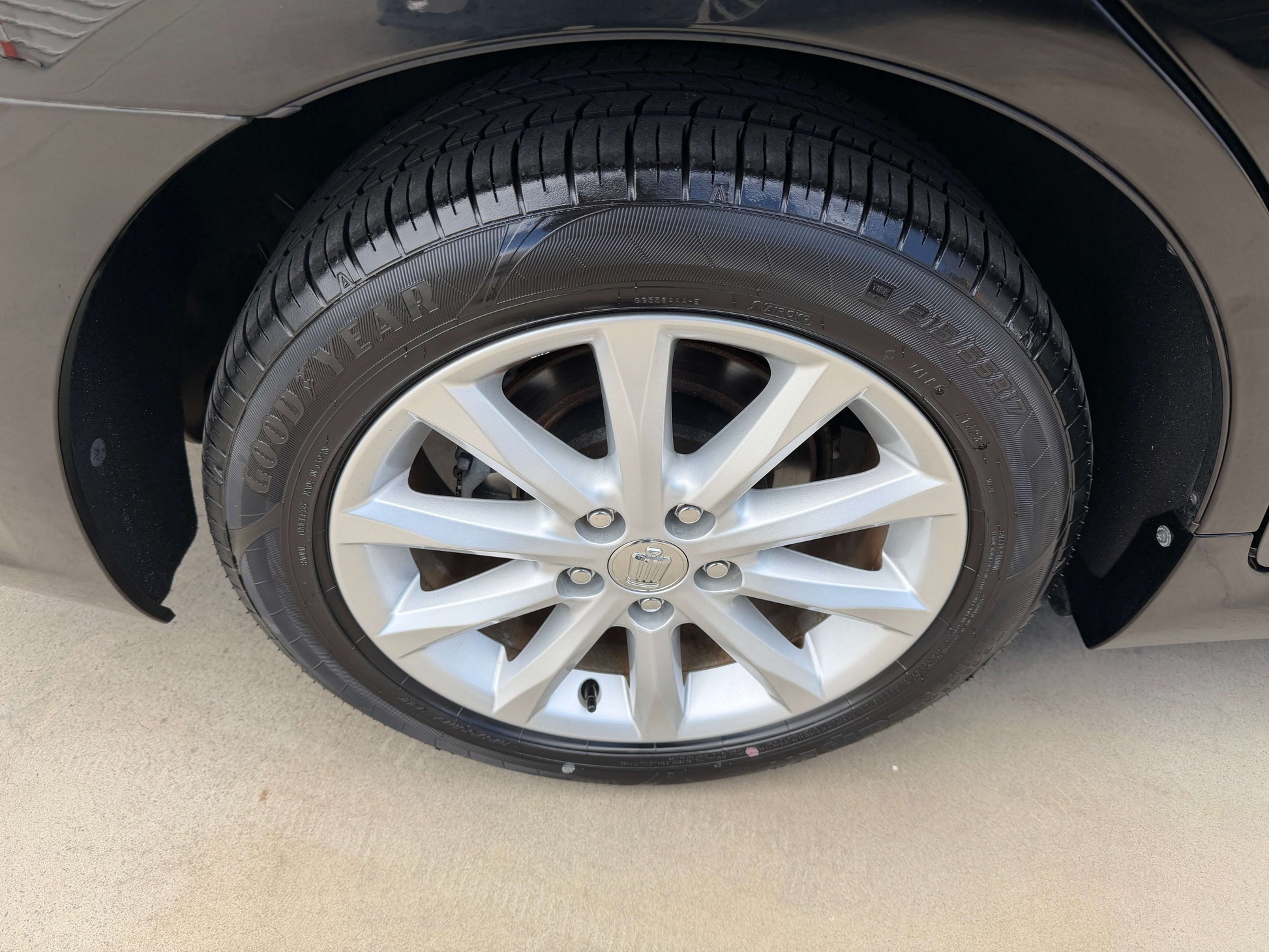 Close-up of a wheel and tire of a 2008 Toyota Crown V6 3.0L Royal Saloon Edition Luxury Sedan.