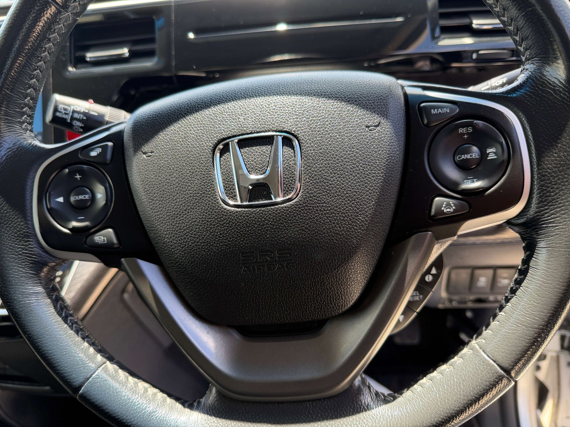 Interior view of the steering wheel in a 2019 Honda Honda Stepwgn 2.0 Spada Hybrid G Honda Sensing vehicle.
