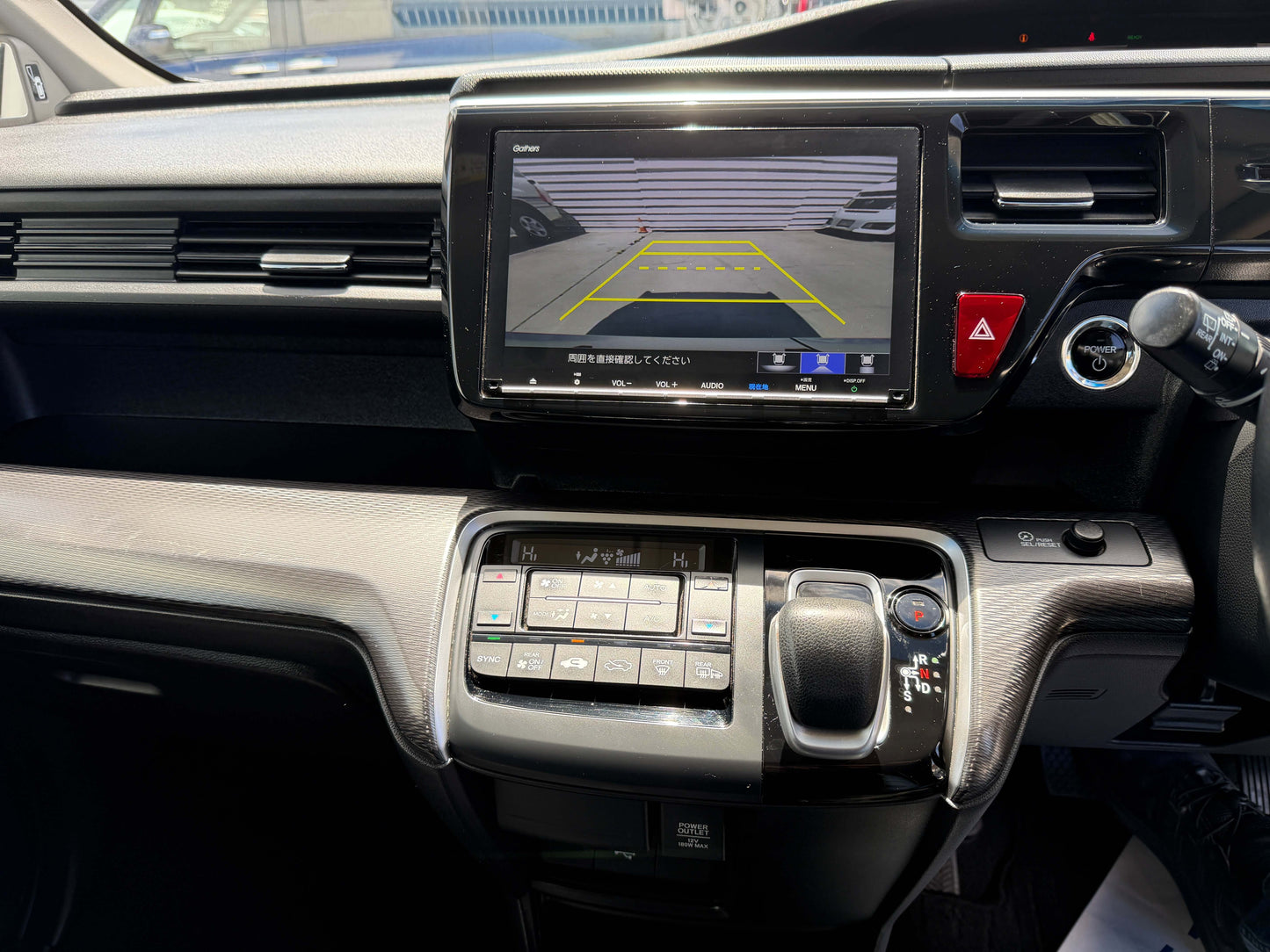 Interior view of 2019 Honda Honda Stepwgn 2.0 Spada Hybrid featuring dashboard and rearview camera display.
