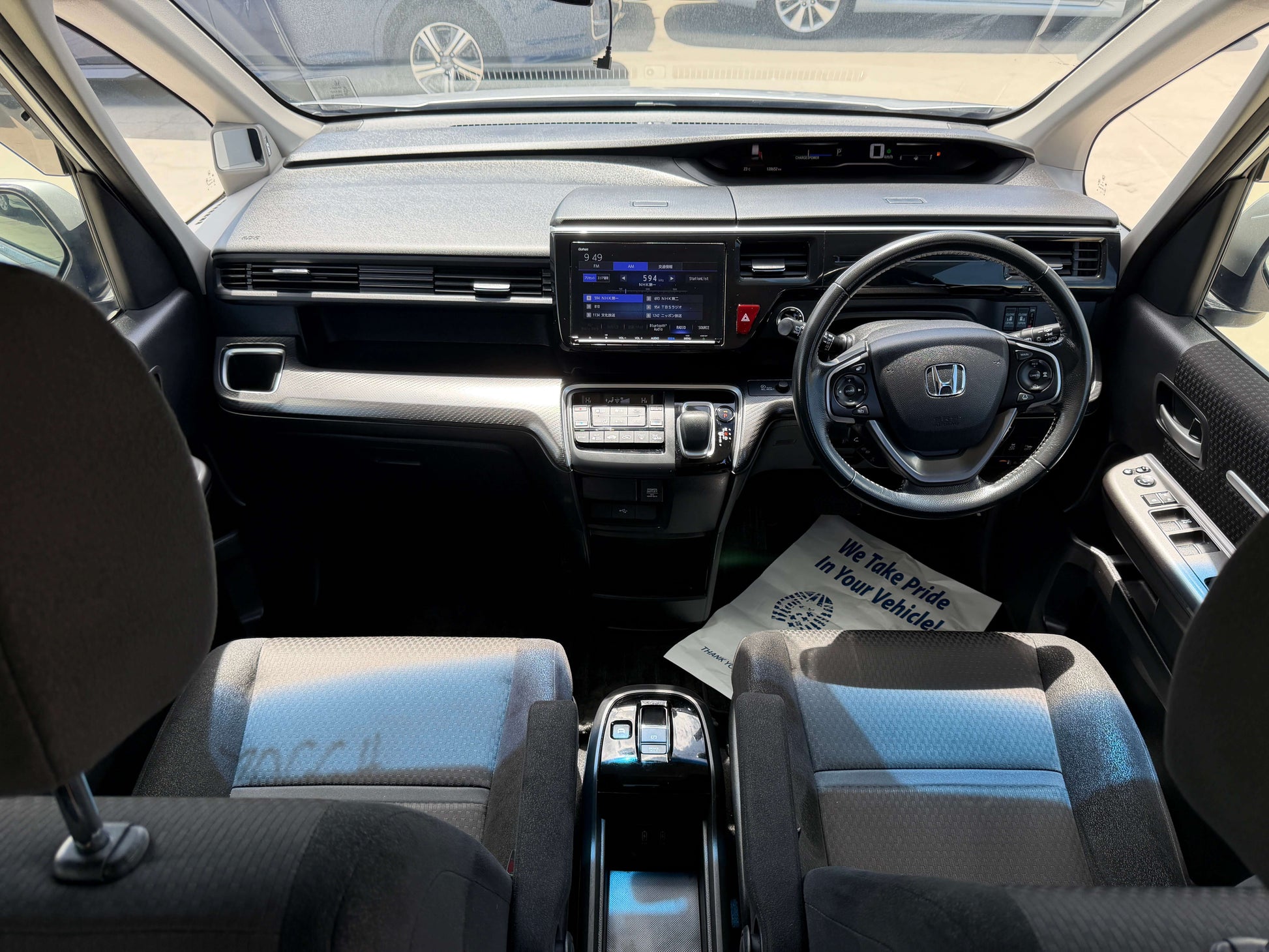 Interior view of the 2019 Honda Honda Stepwgn 2.0 Spada Hybrid showcasing seating and dashboard features.