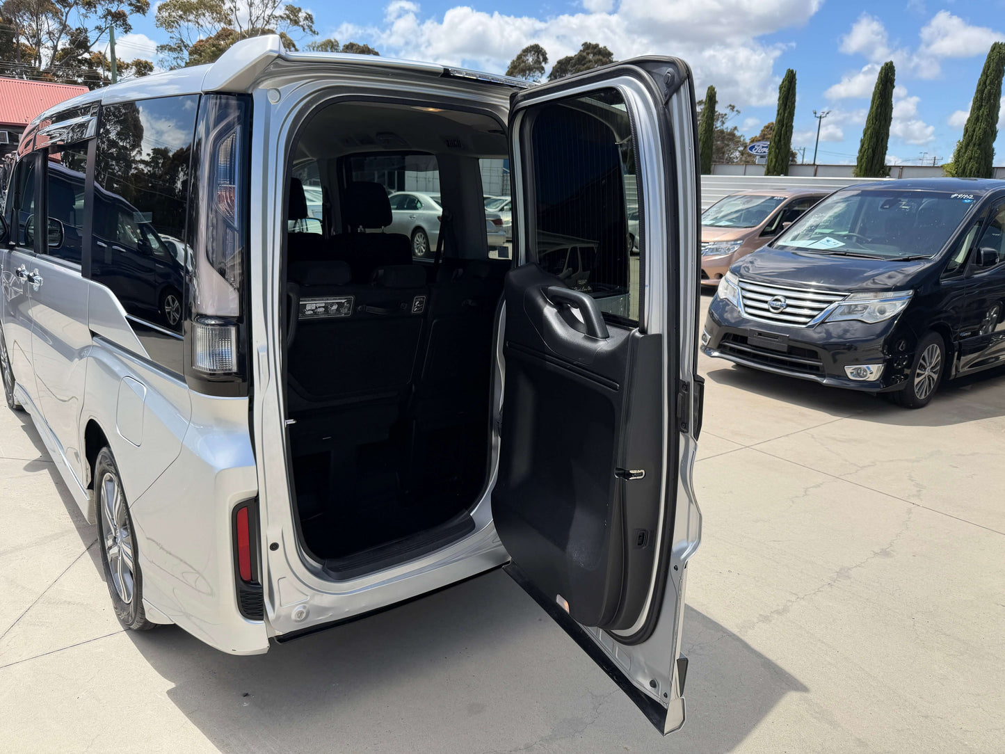 2019 Honda Honda Stepwgn 2.0 Spada Hybrid interior showing open rear door and spacious seating area