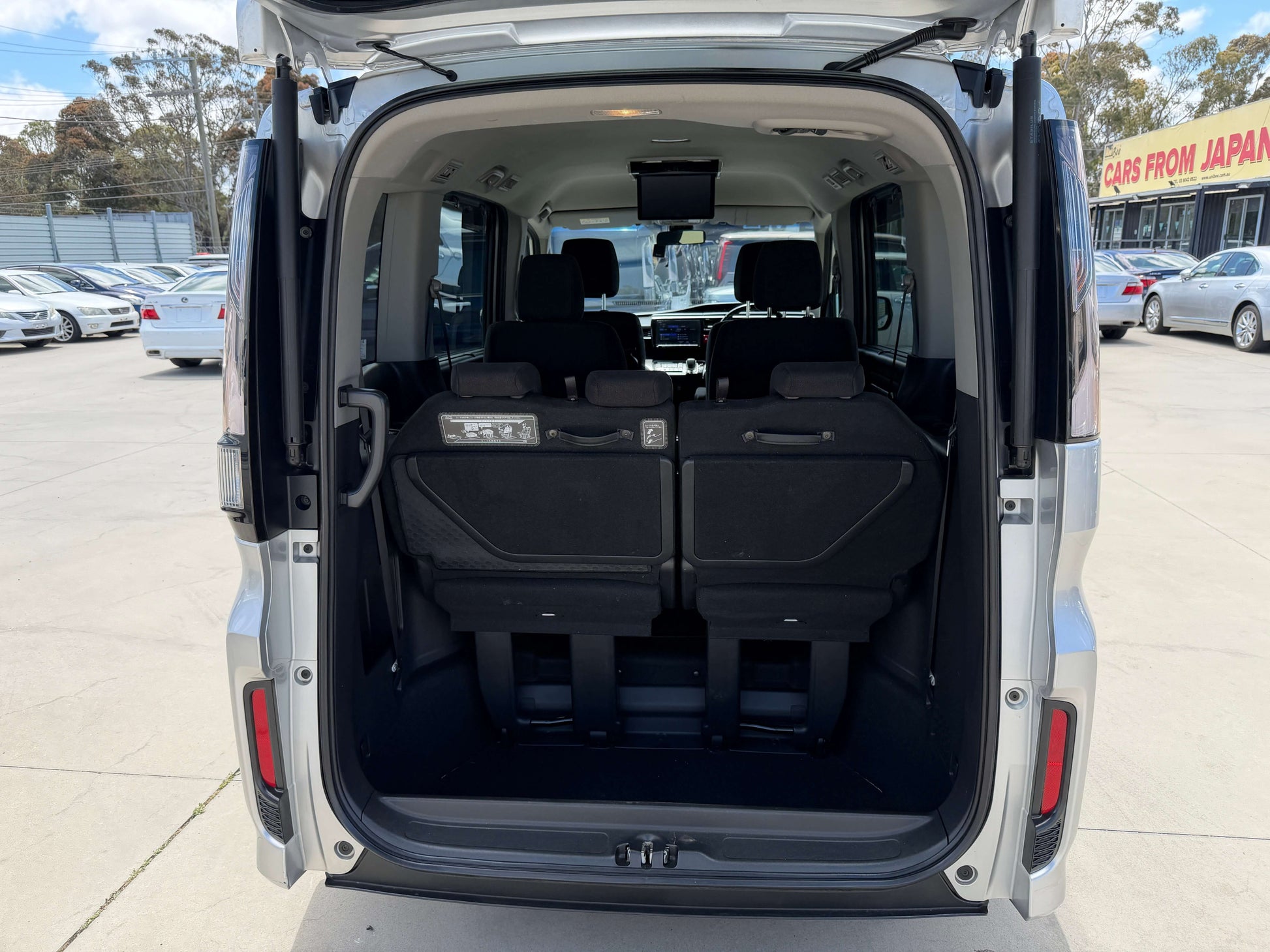 Interior view of the 2019 Honda Honda Stepwgn 2.0 Spada Hybrid with rear seats folded down.
