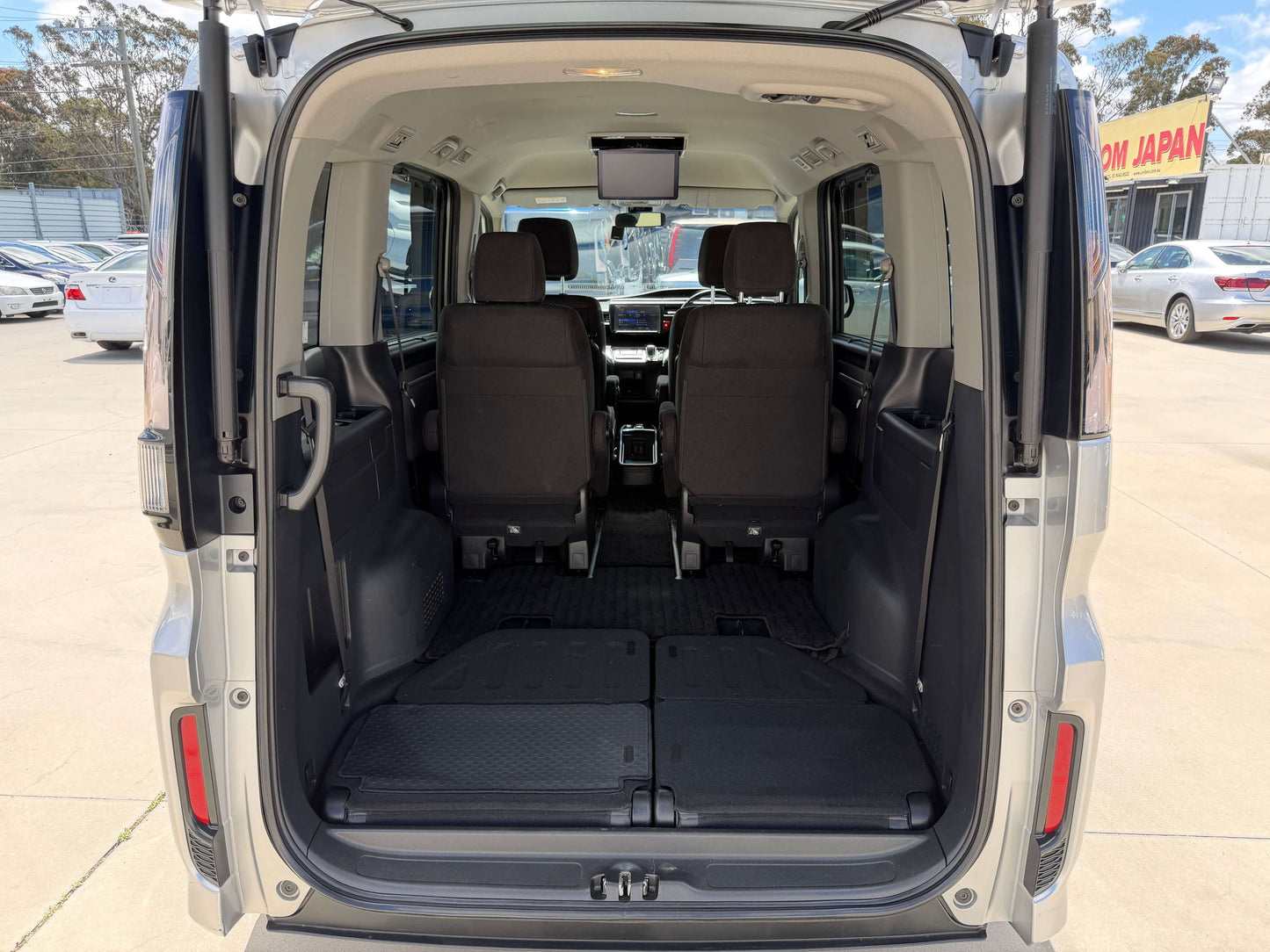 Rear view of the 2019 Honda Honda Stepwgn 2.0 Spada Hybrid interior showcasing spacious seating and cargo area.