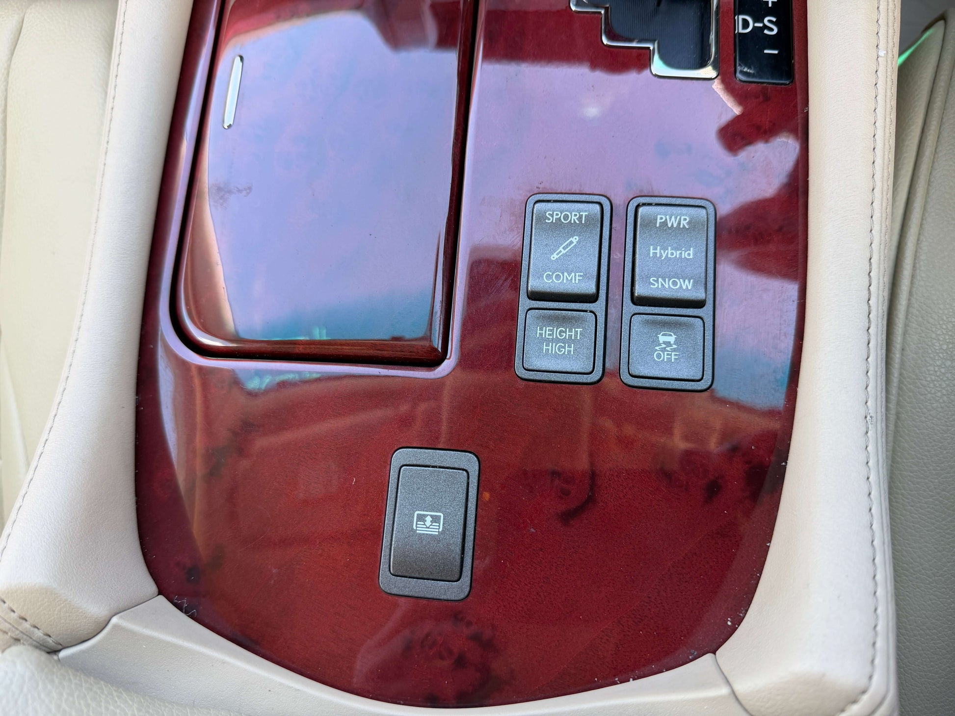 2007 Lexus LS600h AWD V8 5.0L Hybrid interior controls including sport, power, and hybrid buttons.