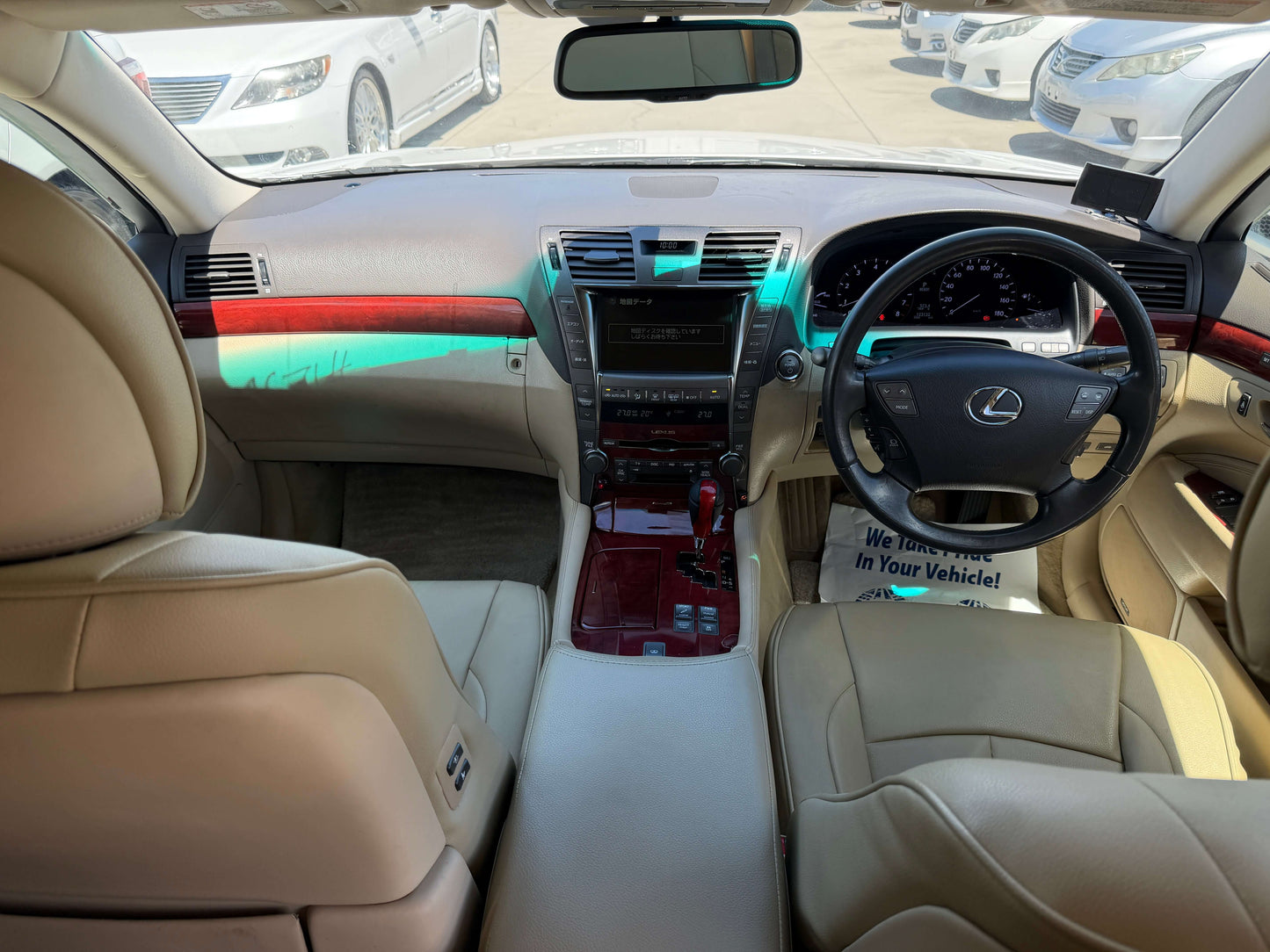Interior view of the 2007 Lexus LS600h AWD V8 5.0L Hybrid luxury sedan showcasing leather seats and elegant dashboard.