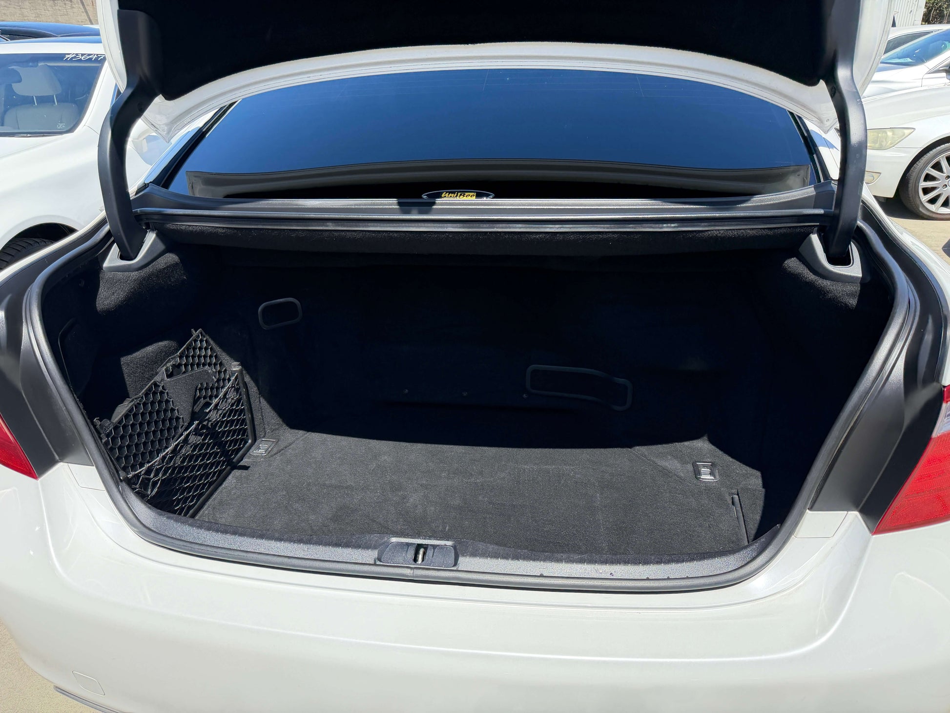 2007 Lexus LS600h AWD V8 5.0L Hybrid trunk view showcasing spacious cargo area and interior features.