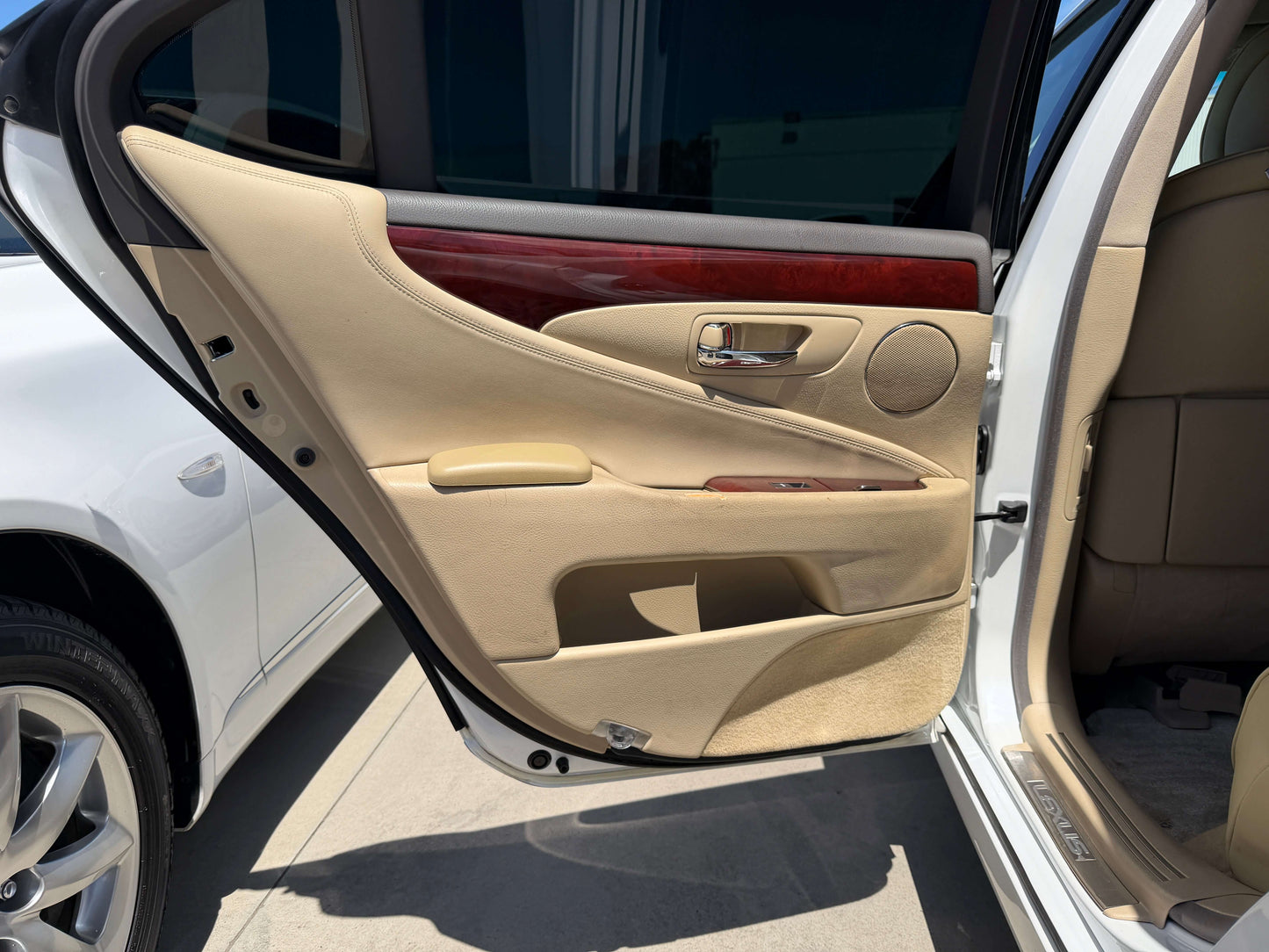 Interior view of the 2007 Lexus LS600h AWD V8 5.0L Hybrid luxury sedan door showcasing its elegant design.
