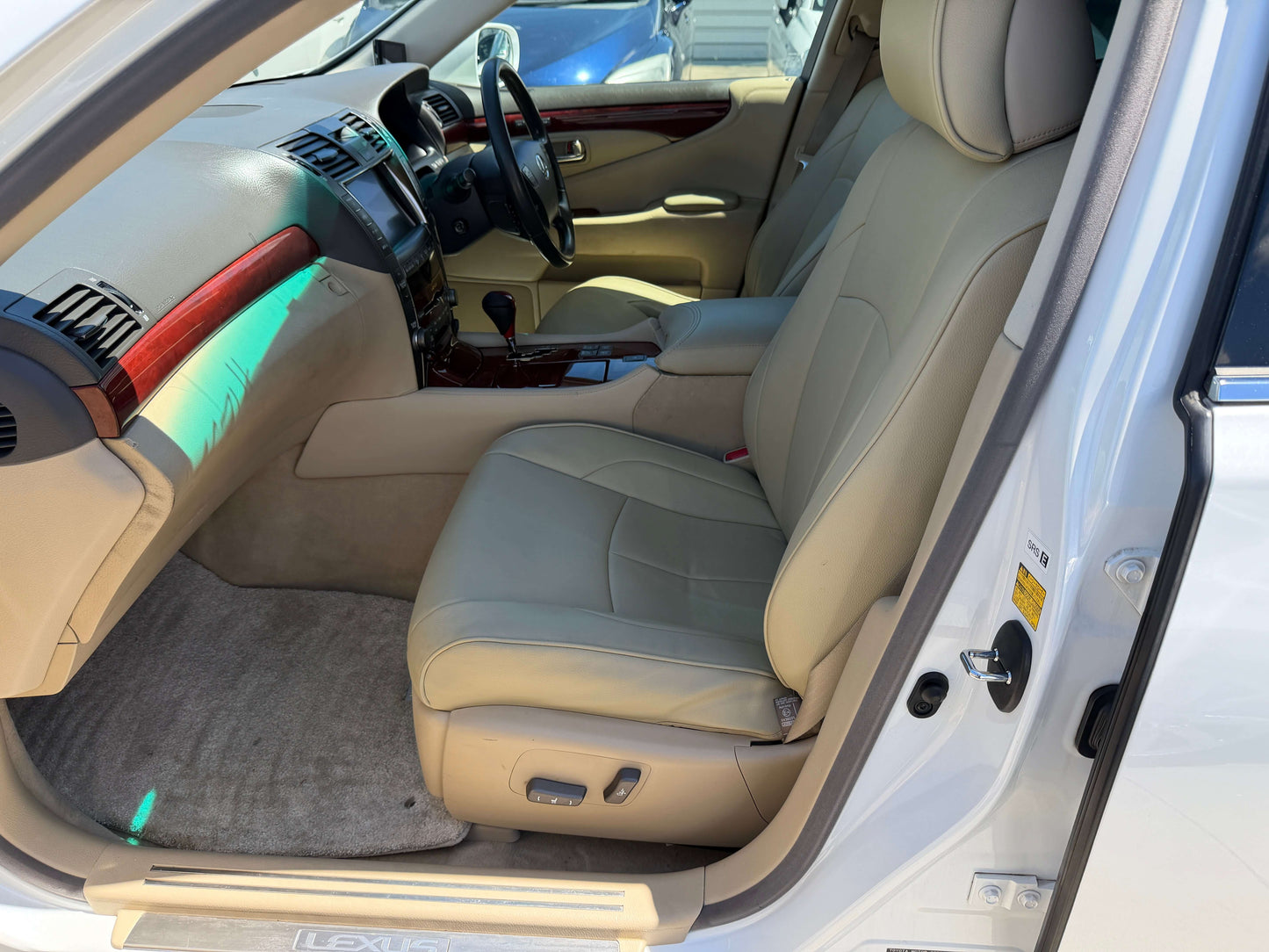 2007 Lexus LS600h AWD V8 5.0L Hybrid luxury sedan interior with beige leather seats and dashboard.