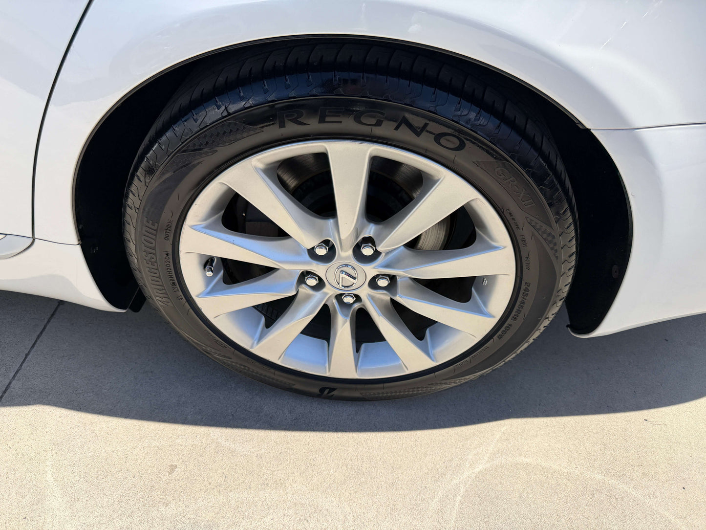 Close-up view of the alloy wheel of a 2007 Lexus LS600h AWD V8 5.0L Hybrid Luxury Sedan, highlighting its sleek design.