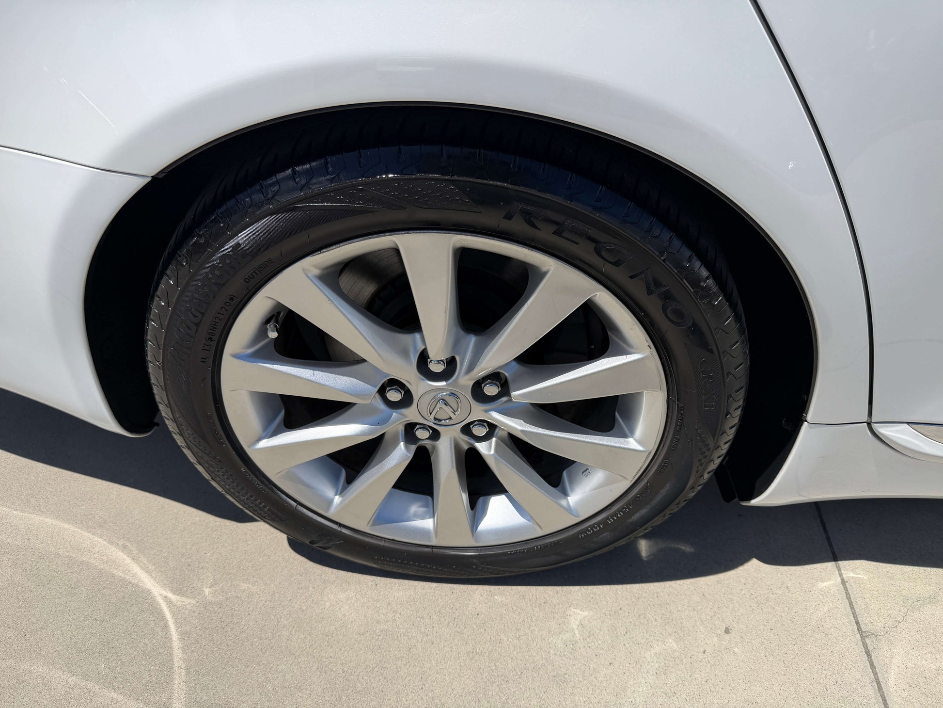Close-up of wheel and alloy rim of 2007 Lexus LS600h AWD V8 5.0L Hybrid Luxury Sedan.