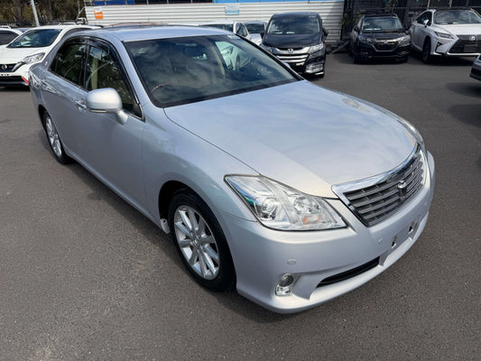 2010 Toyota Crown V6 3.0L luxury sedan in silver color parked, showcasing its sleek design and elegant features.
