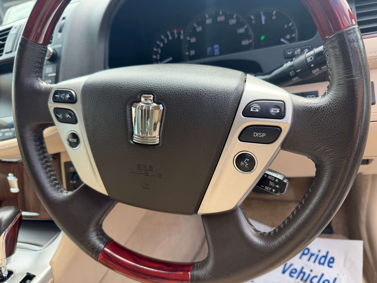 Interior view of the steering wheel of a 2010 Toyota Crown V6 3.0L Royal Saloon G Edition Luxury Sedan.