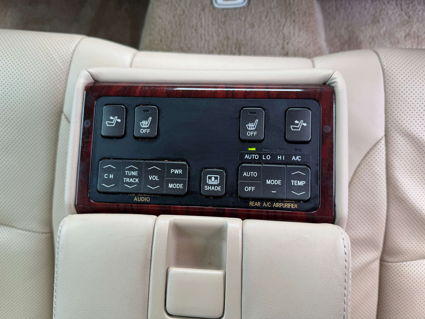 Interior control panel of a 2010 Toyota Crown V6 3.0L Royal Saloon G Edition Luxury Sedan with climate and audio features