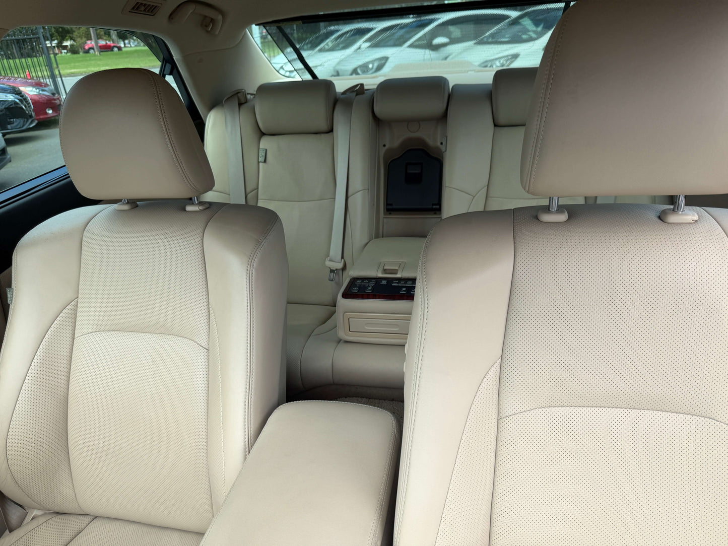 Interior view of a 2010 Toyota Crown V6 3.0L Royal Saloon G Edition Luxury Sedan, featuring beige leather seats and spacious design.