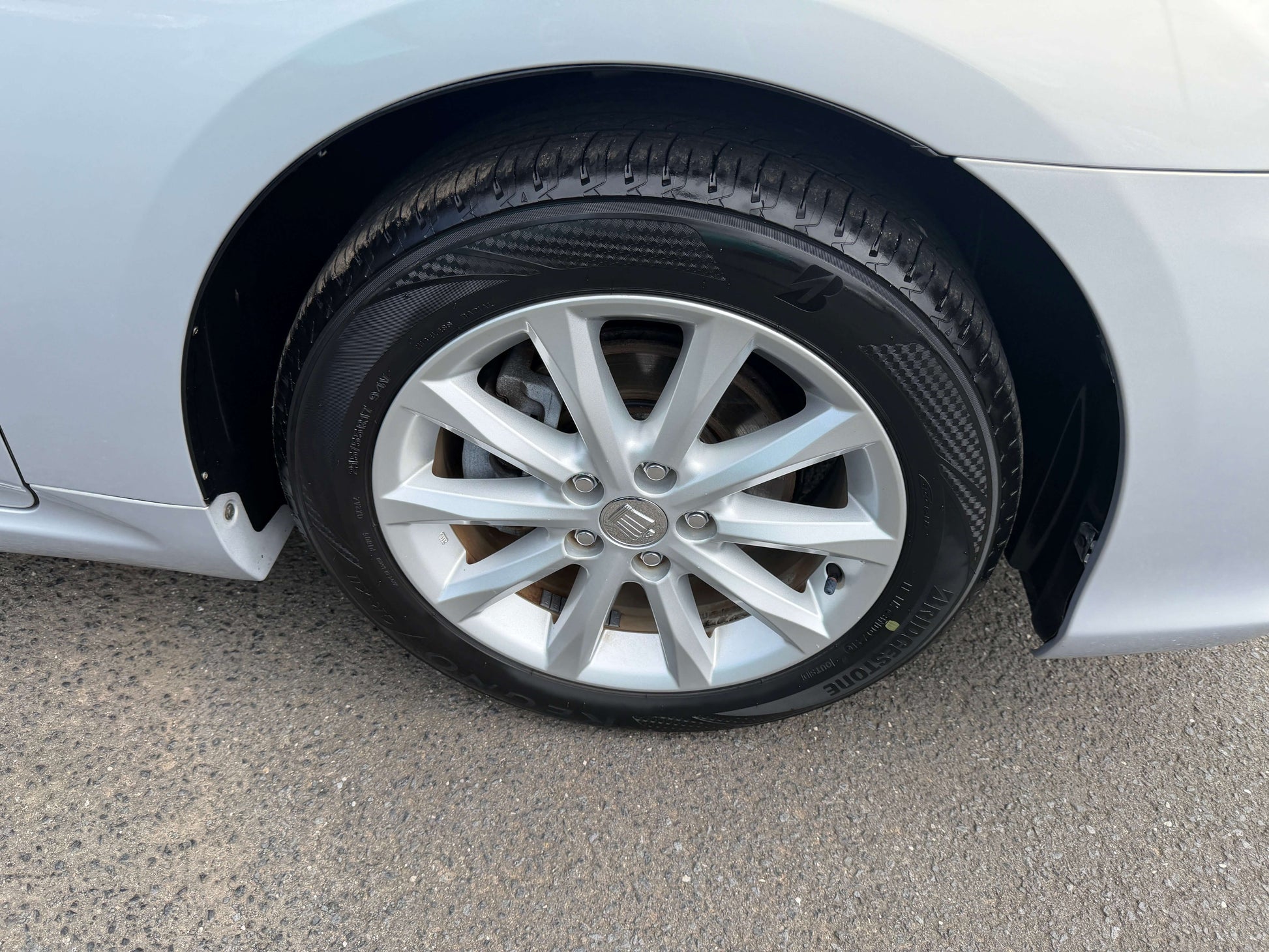 2010 Toyota Crown V6 3.0L luxury sedan wheel showing alloy rim and tire details.